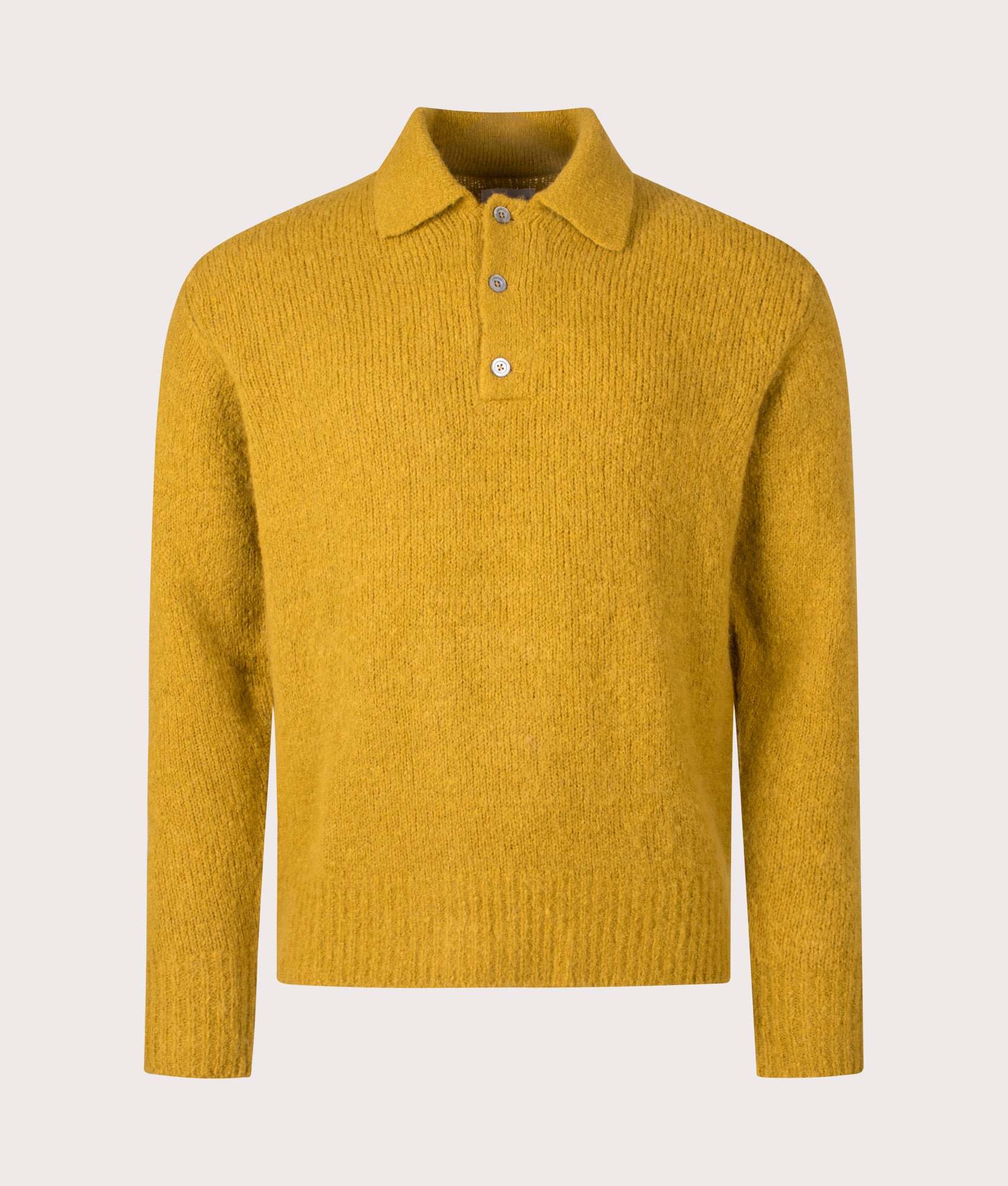 Norse Projects Relaxed Fit Rasmus Brushed Polo Shirt in Warm Yellow at EQVVS Menswear. Front shot.