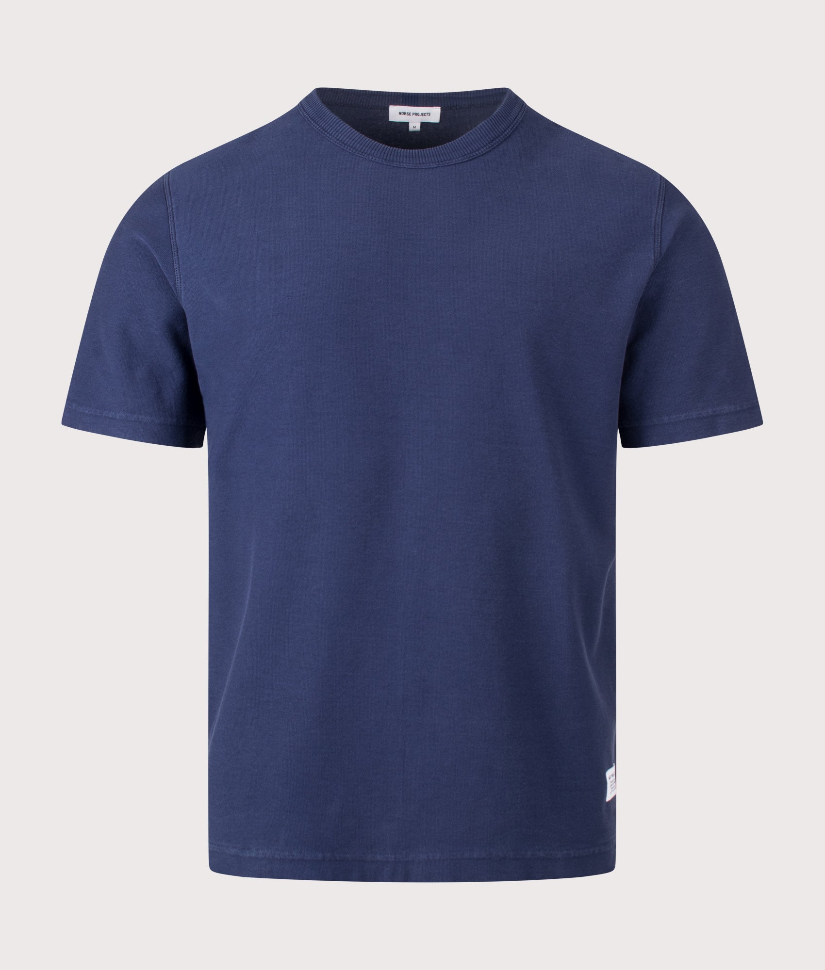 Norse Projects Relaxed Fit Elmelunde Organic Cotton GMD T-Shirt in Workwear Blue at EQVVS Menswear. Front shot.