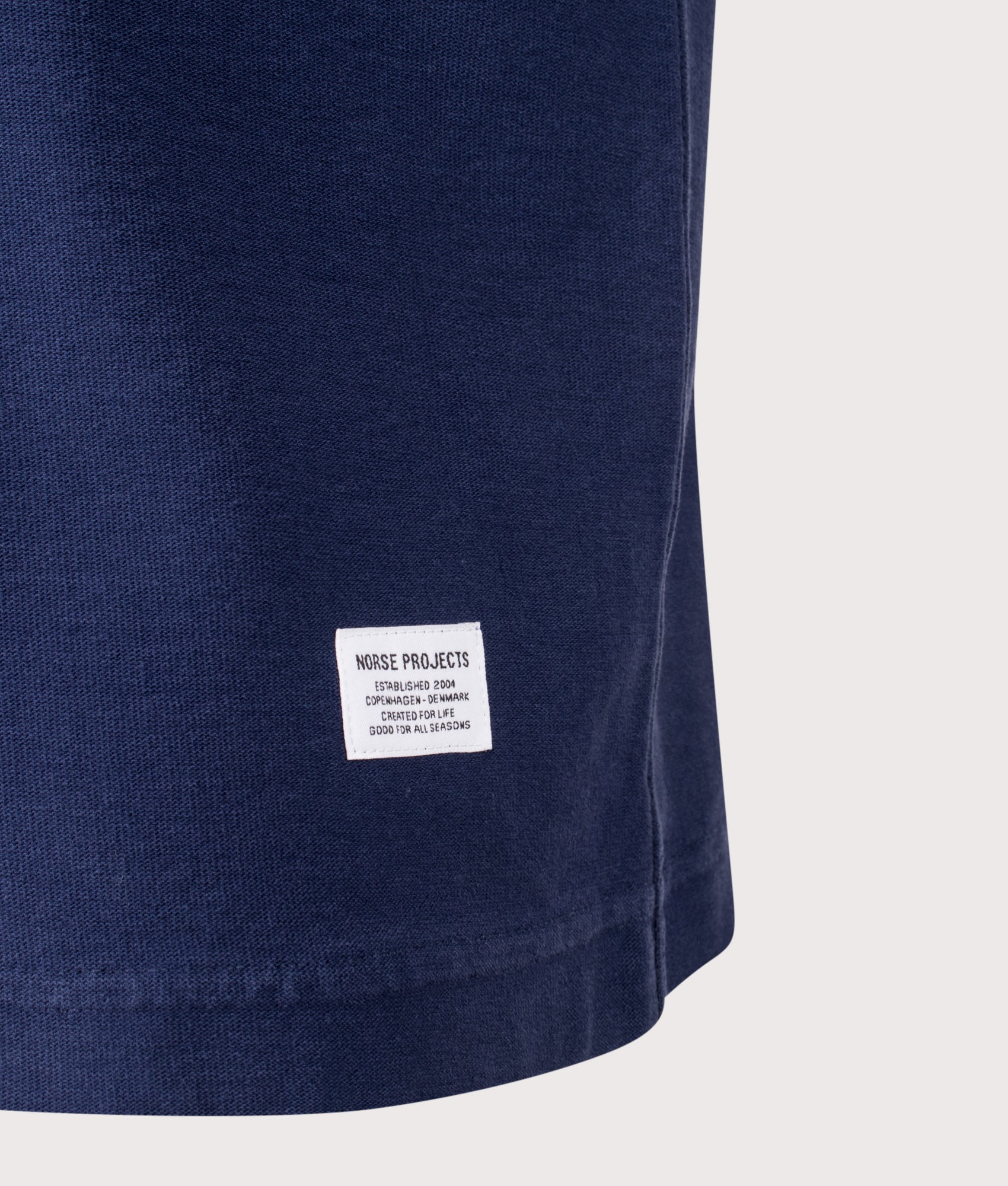 Norse Projects Relaxed Fit Elmelunde Organic Cotton GMD T-Shirt in Workwear Blue at EQVVS Menswear. Detail shot.
