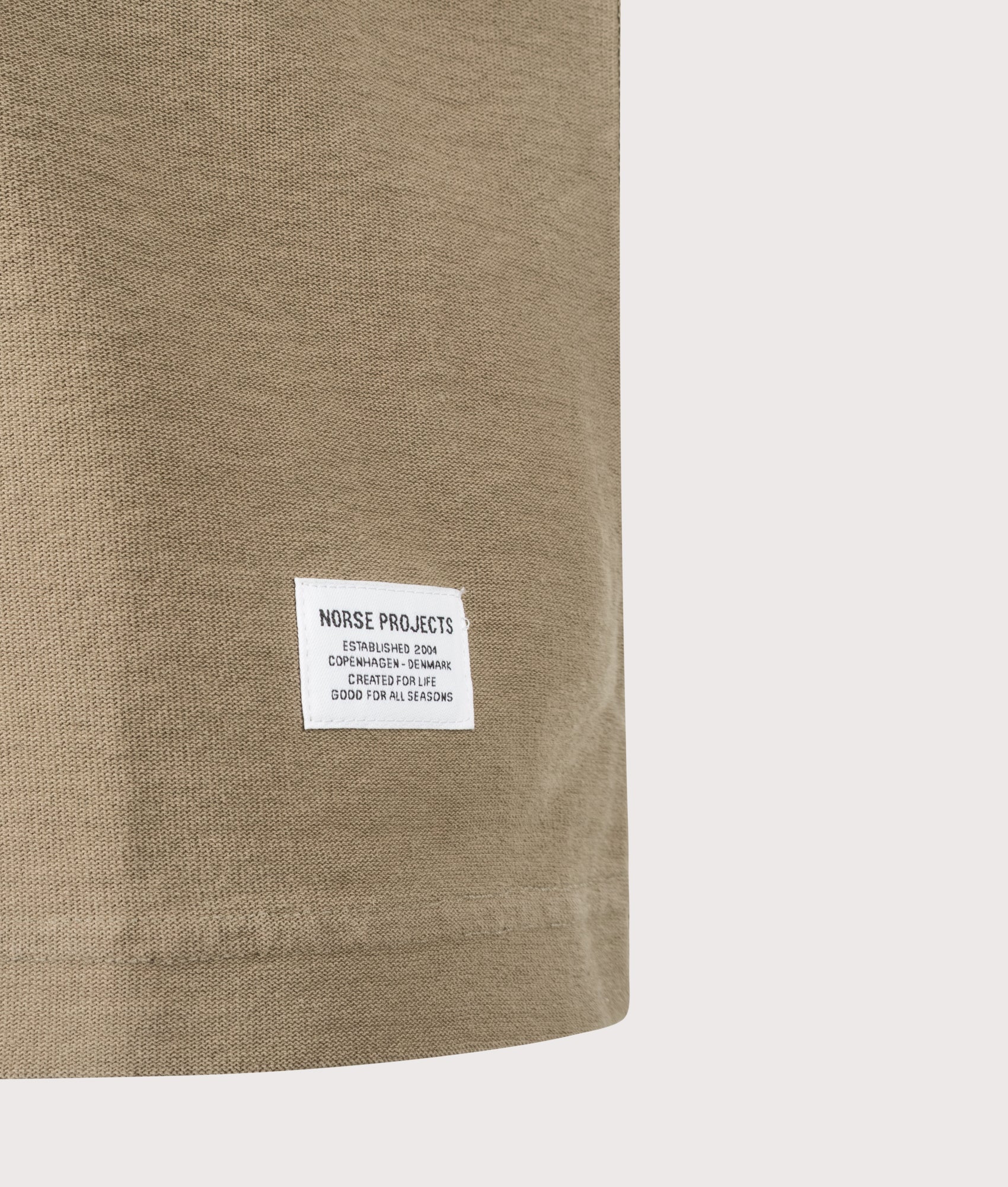 Norse Projects Relaxed Fit Elmelunde Organic Cotton GMD T-Shirt in Walnut at EQVVS Menswear. Detail shot.