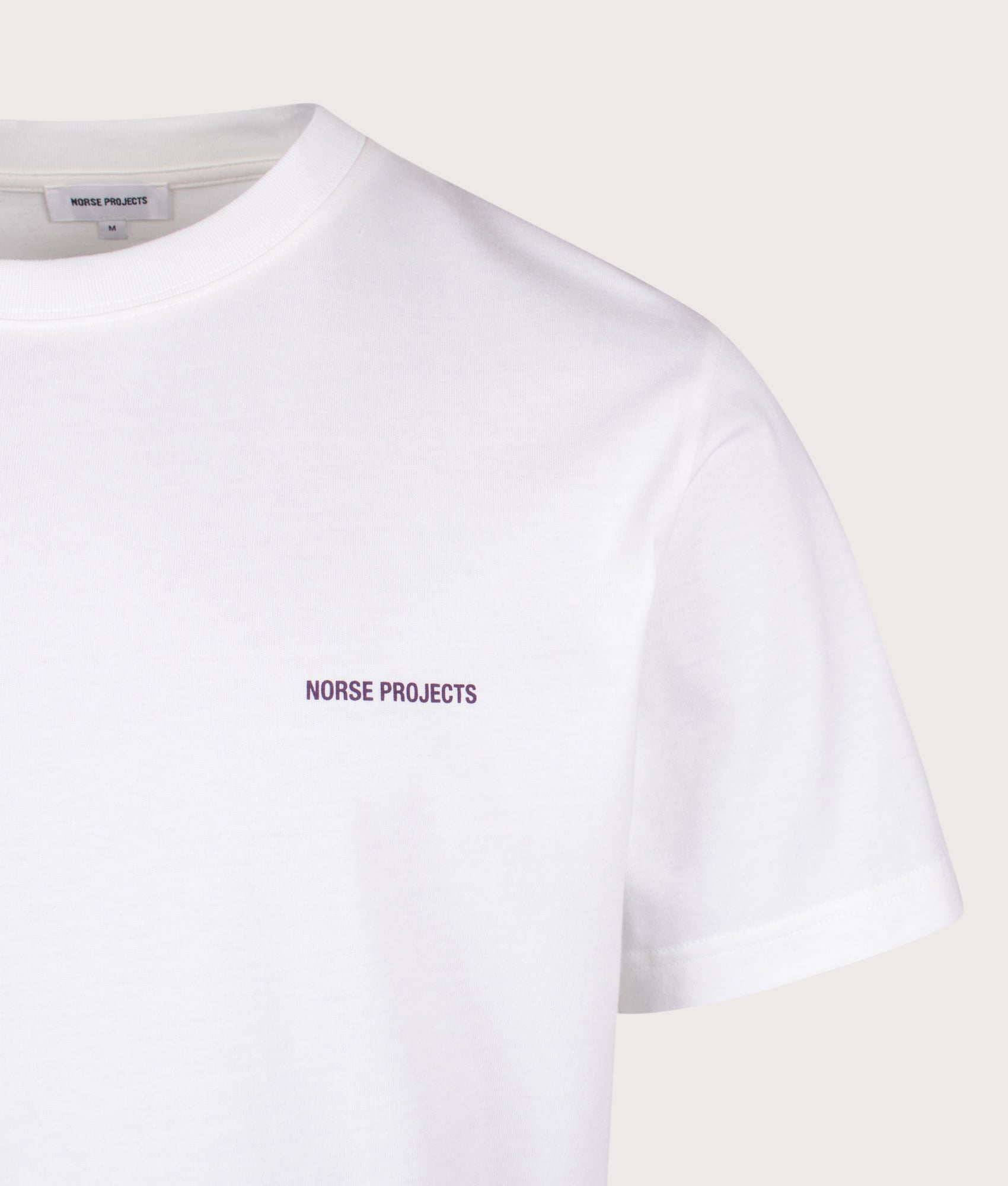 Norse Projects Dyrehaven Organic Logo Print T-Shirt in White at EQVVS Menswear. Detail shot.