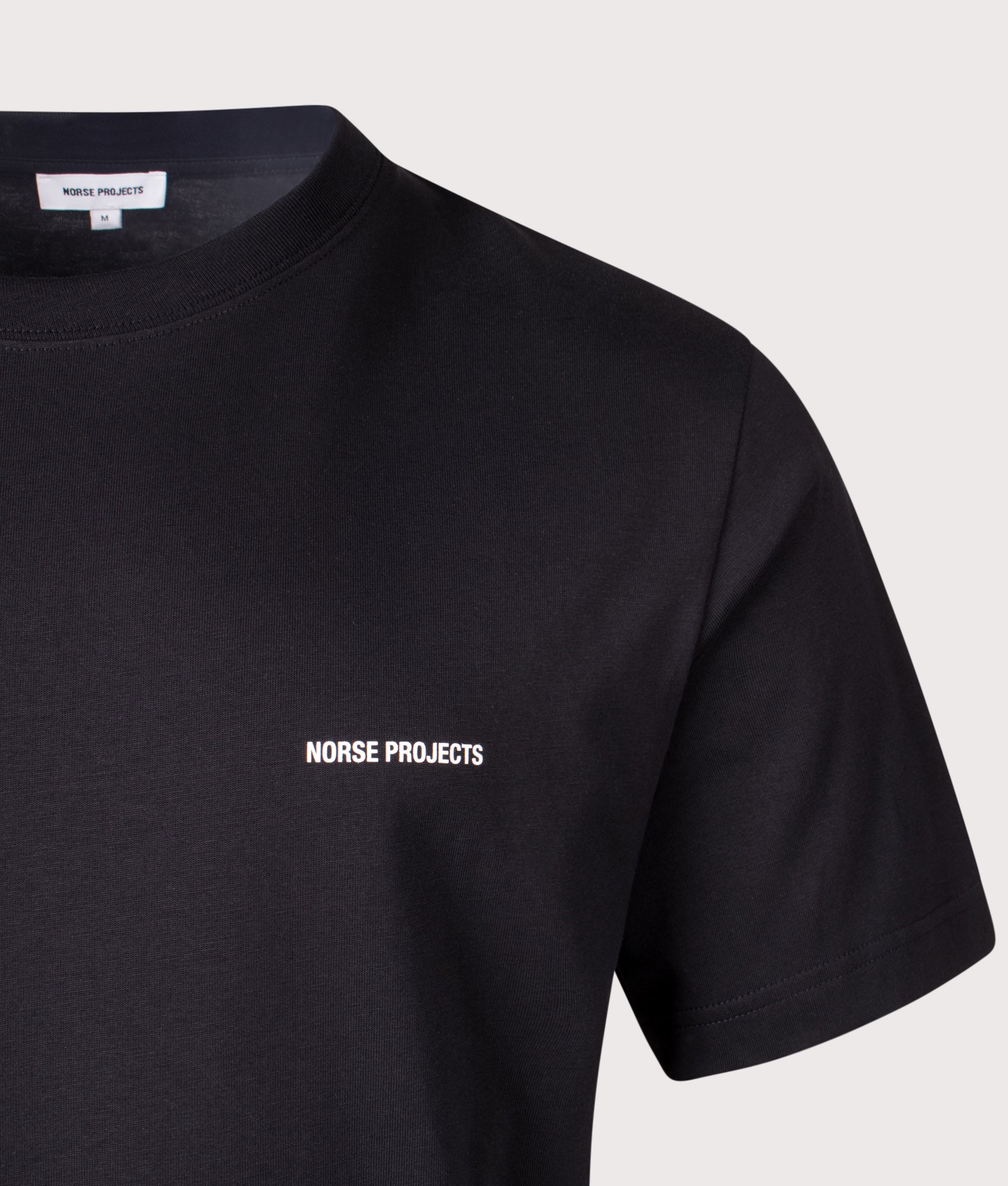 Norse Projects Dyrehaven Organic Logo Print T-Shirt in Black at EQVVS Menswear. Detail shot.
