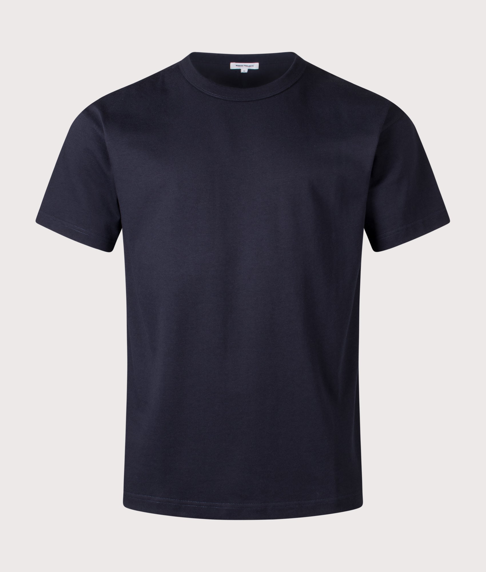 Norse Projects Snekkersten Organic Arch Print T-Shirt in Dark Navy at EQVVS Menswear. Front shot.