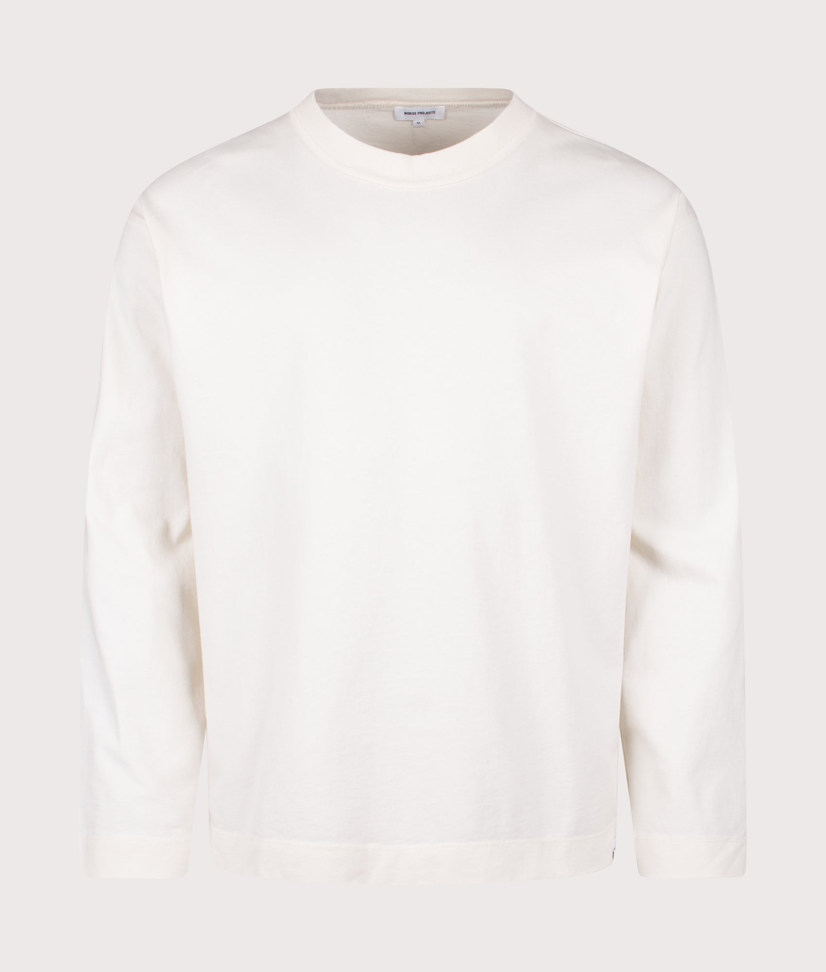 Norse Projects Relaxed Fit Isefjord Compact Long Sleeve T-Shirt in Ecru at EQVVS Menswear. Front shot.