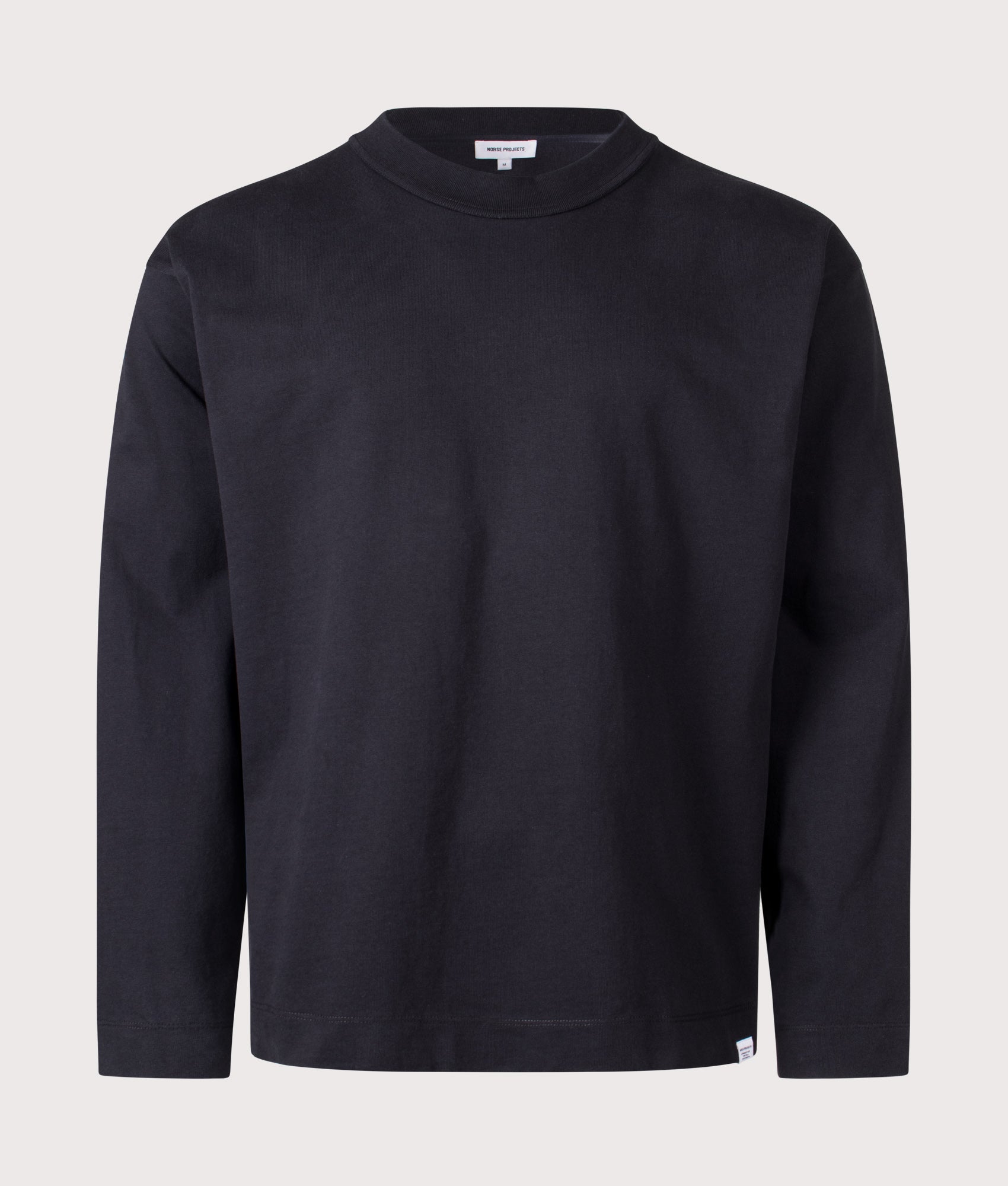 Norse Projects Relaxed Fit Isefjord Compact Long Sleeve T-Shirt in Black at EQVVS Menswear. Front shot.