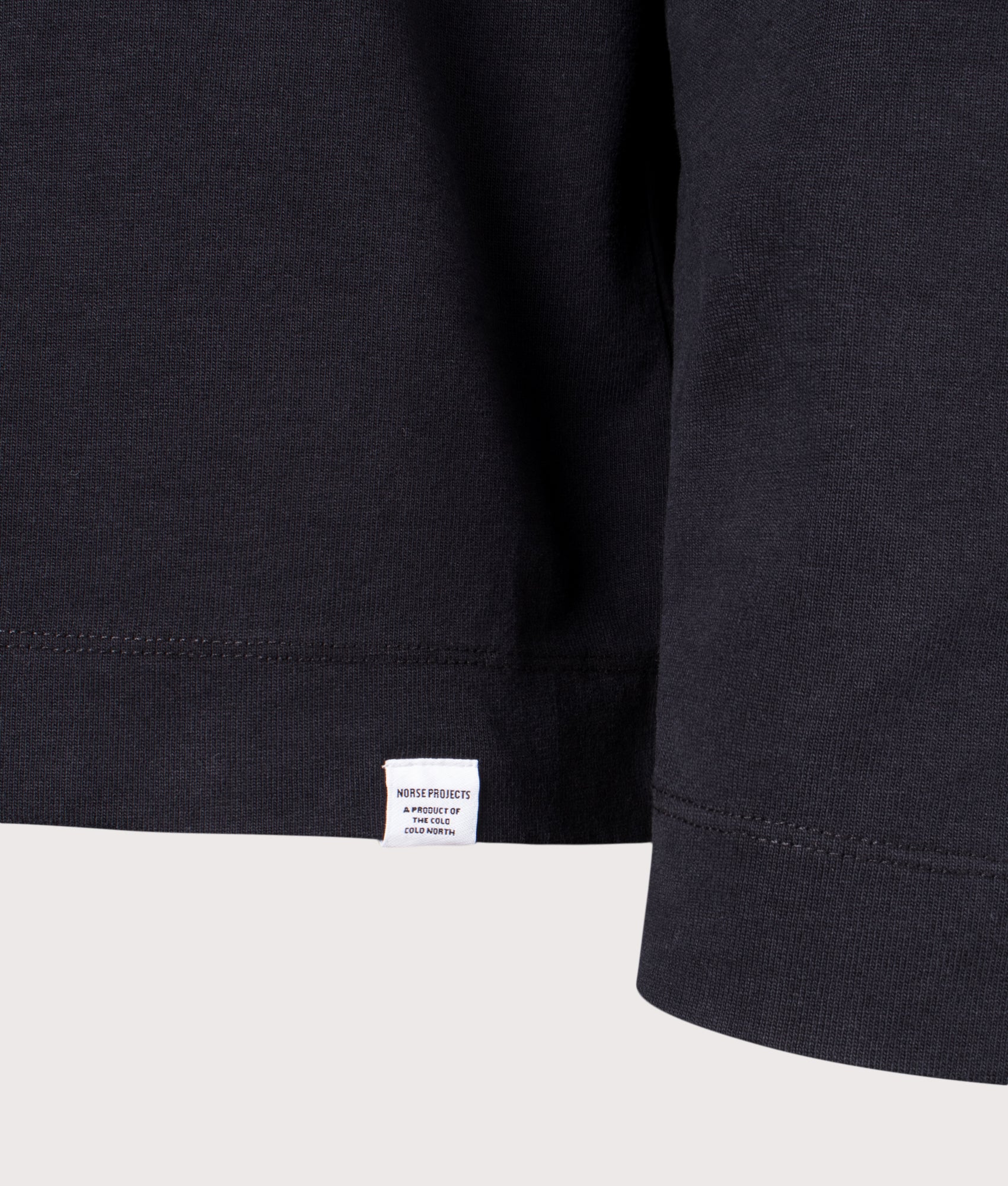 Norse Projects Relaxed Fit Isefjord Compact Long Sleeve T-Shirt in Black at EQVVS Menswear. Detail shot.