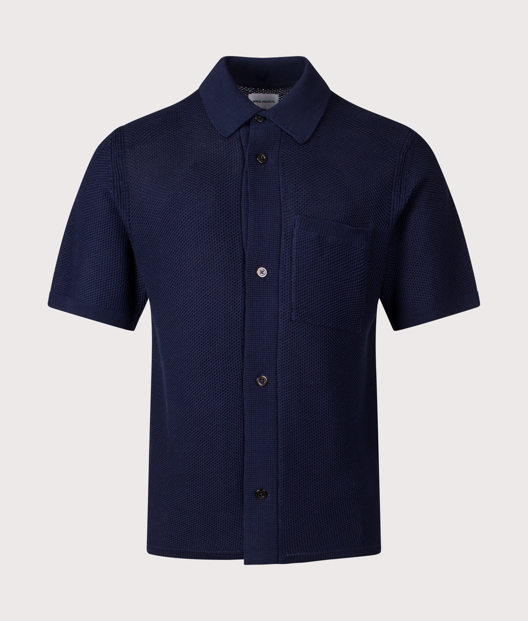 Norse Projects Fredensborg Short Sleeve Knitted Shirt in Dark Navy at EQVVS Menswear. Front shot.