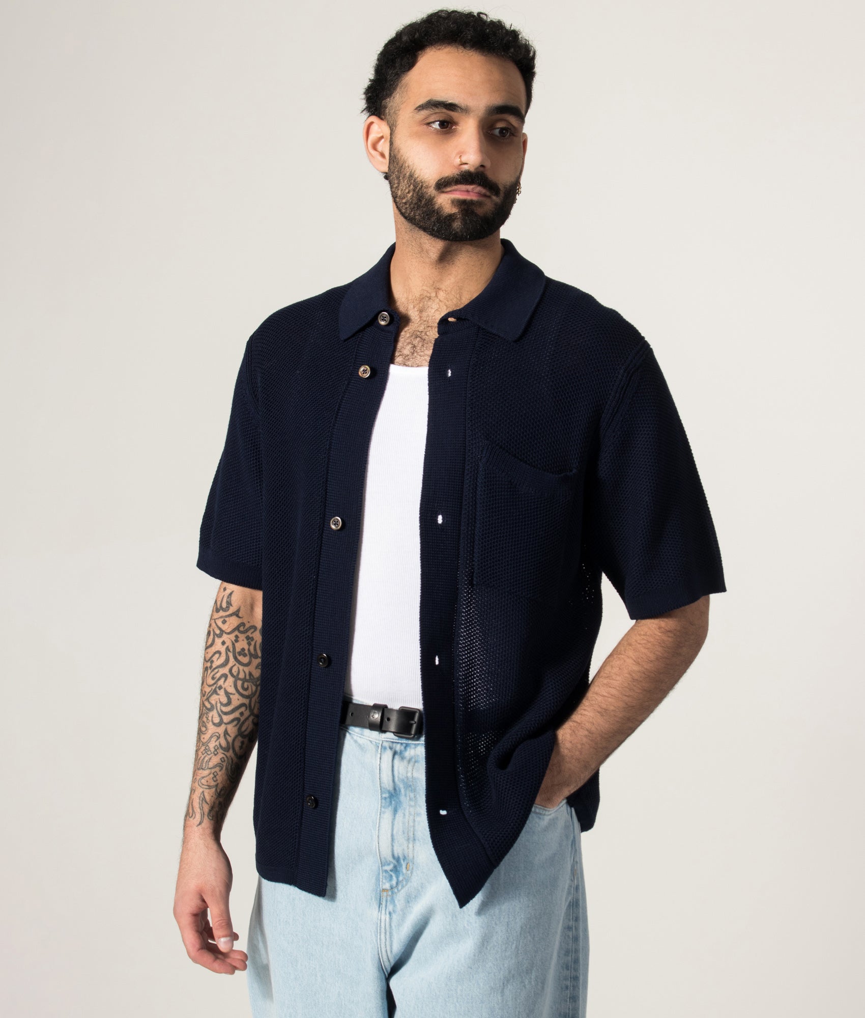 Norse Projects Fredensborg Short Sleeve Knitted Shirt in Dark Navy at EQVVS Menswear. Model front shot.