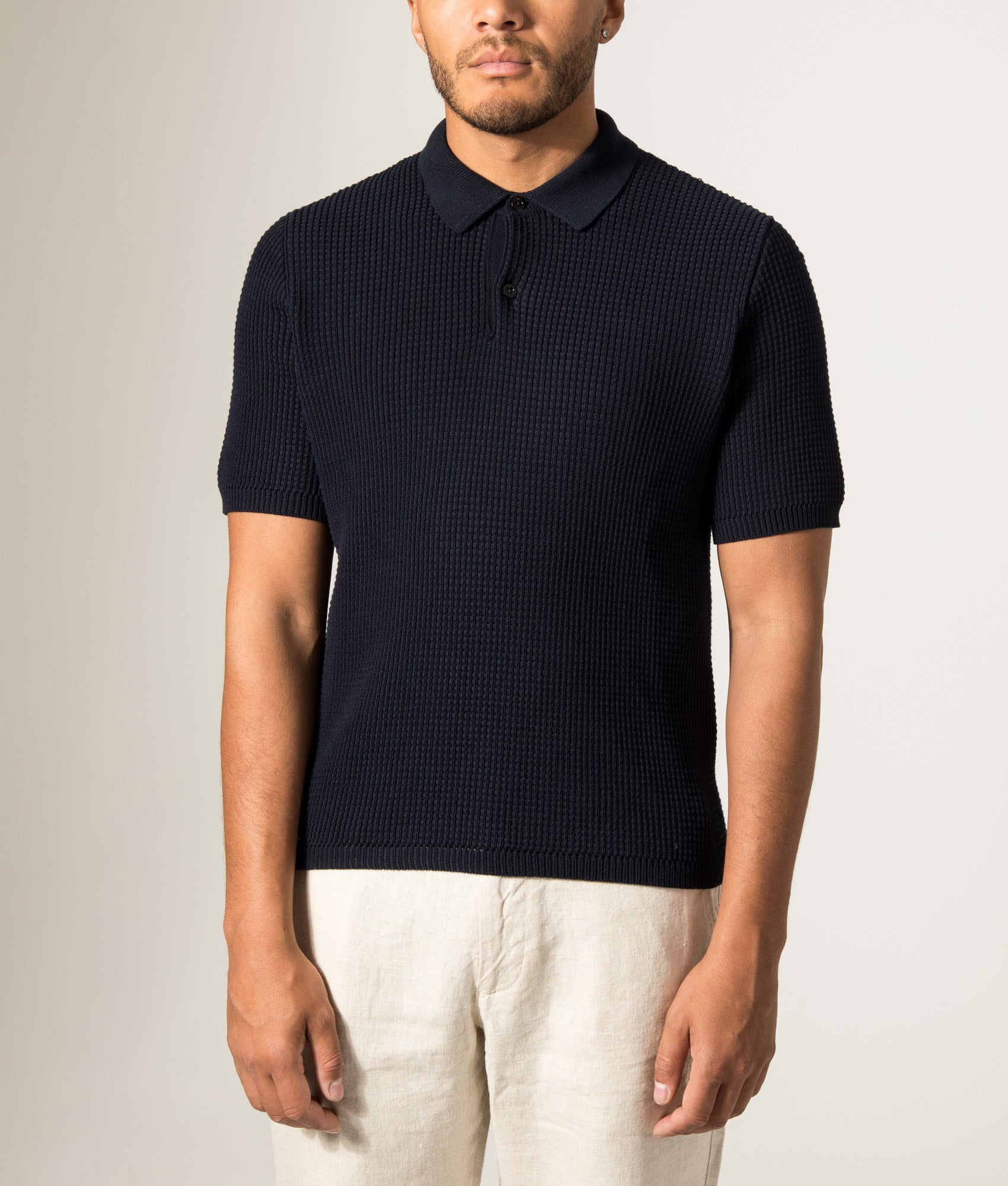 Norse Projects Anholt Cotton Crepe Polo Shirt in Dark Navy at EQVVS Menswear. Model front shot.