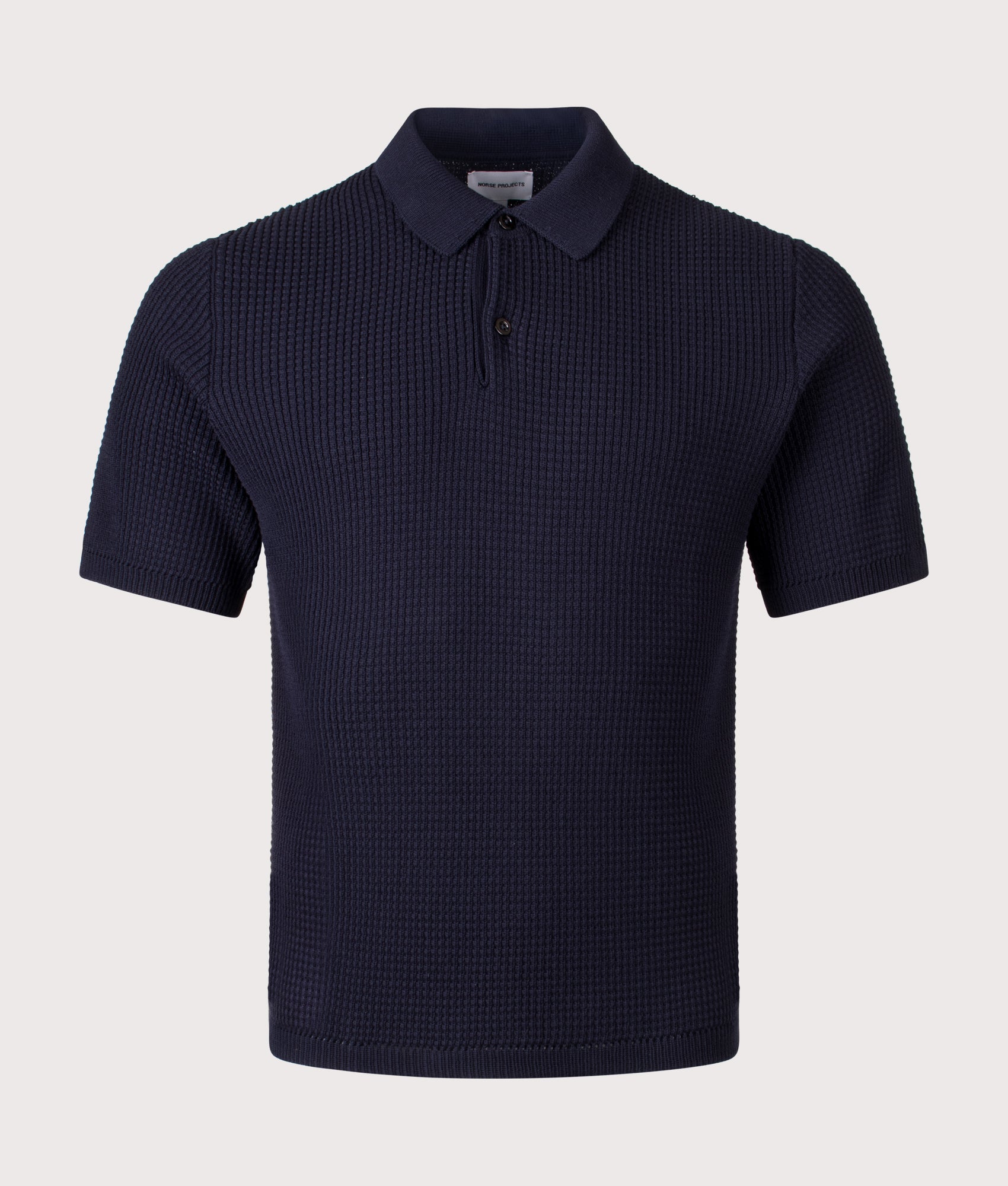 Norse Projects Anholt Cotton Crepe Polo Shirt in Dark Navy at EQVVS Menswear. Front shot.