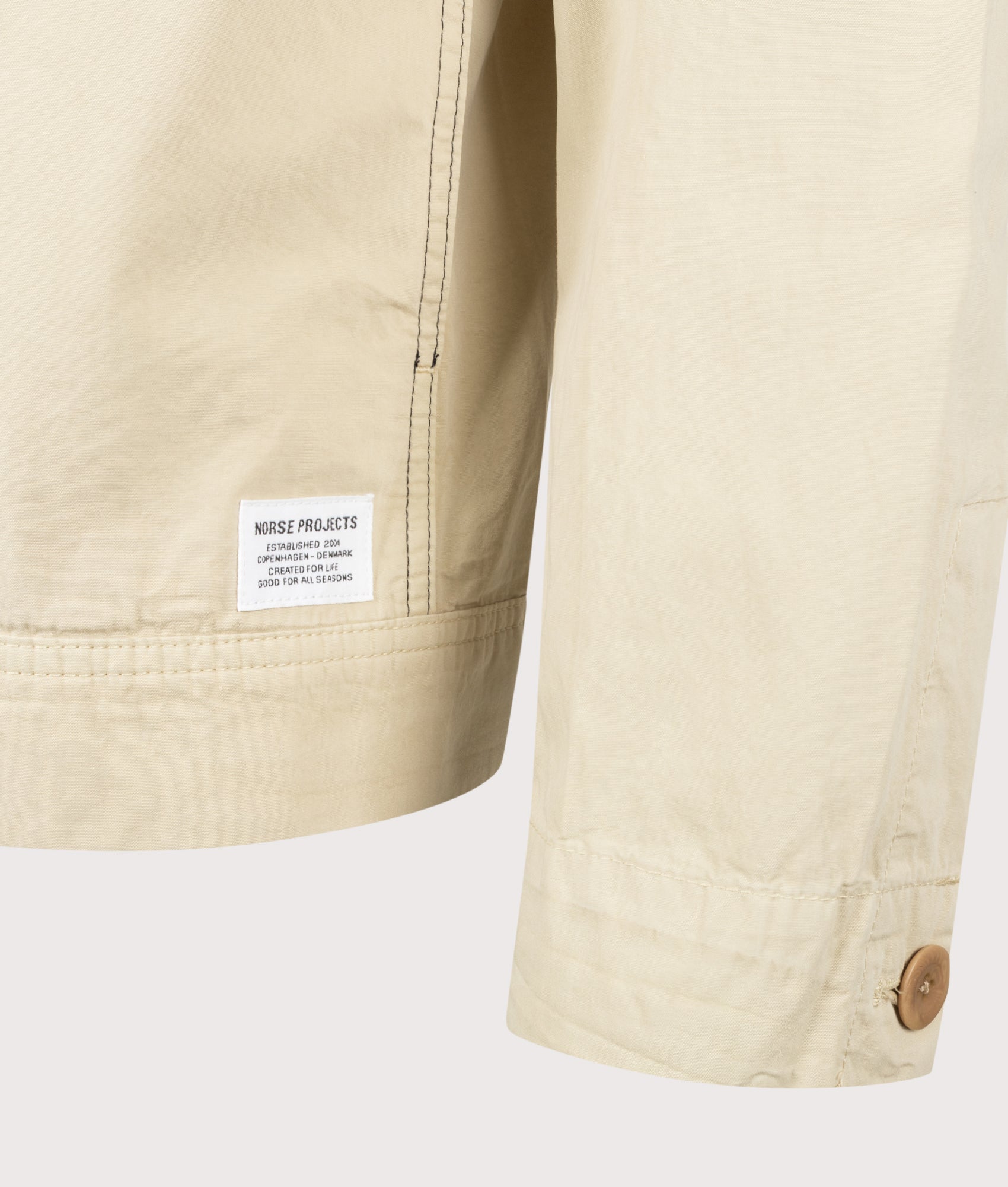 Norse Projects Arresskov Compact Cotton Overshirt in Utility Khaki at EQVVS Menswear. Detail shot.