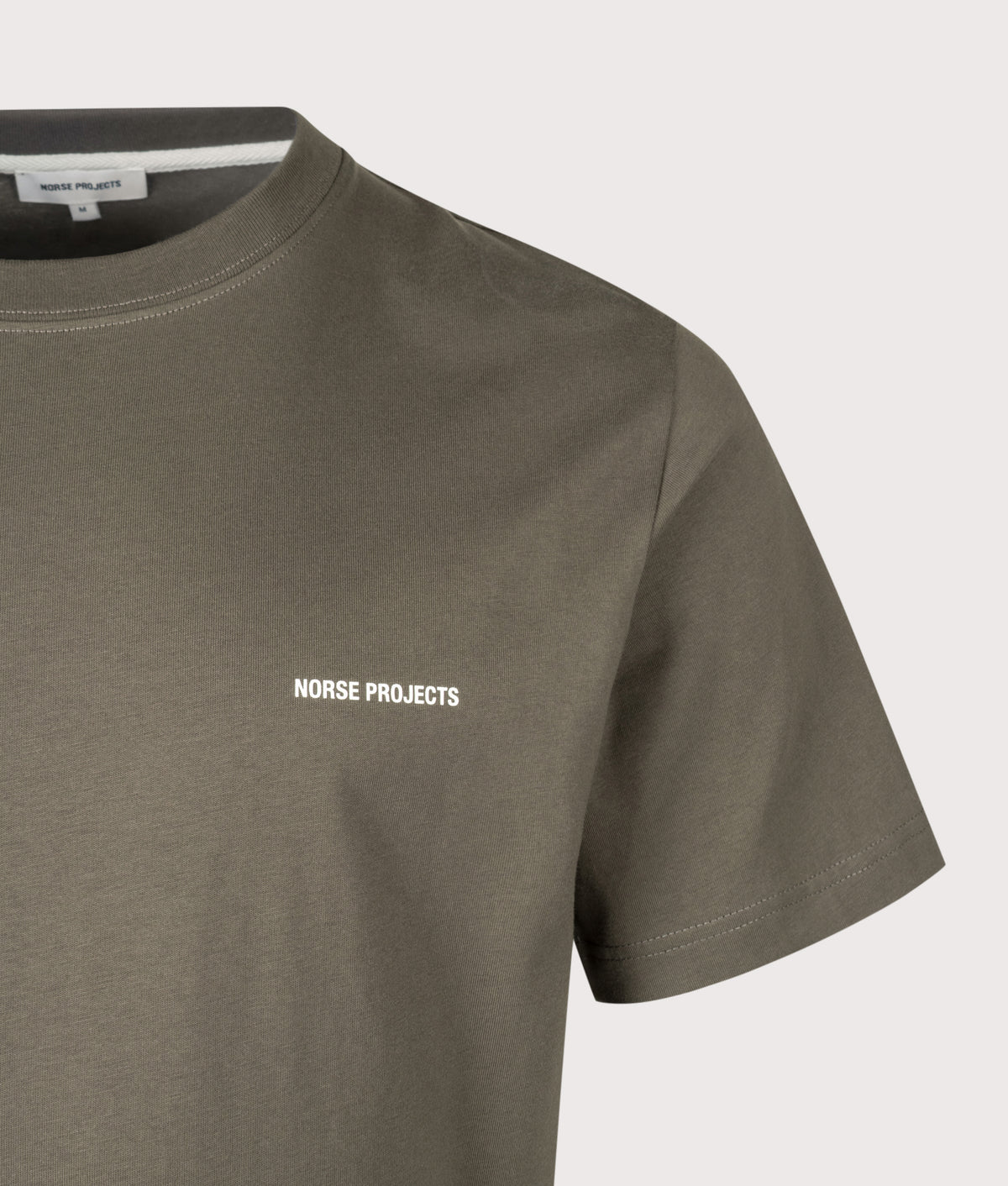 Norse Projects Regular Fit Dyrehaven Organic Logo Print T-Shirt in Beluga at EQVVS Menswear. Detail shot.