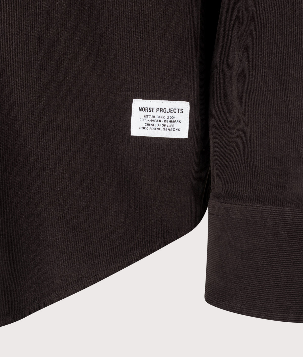 Norse Projects Relaxed Fit Kongshoved Micro Cord Shirt in Espresso at EQVVS Menswear. Detail shot.