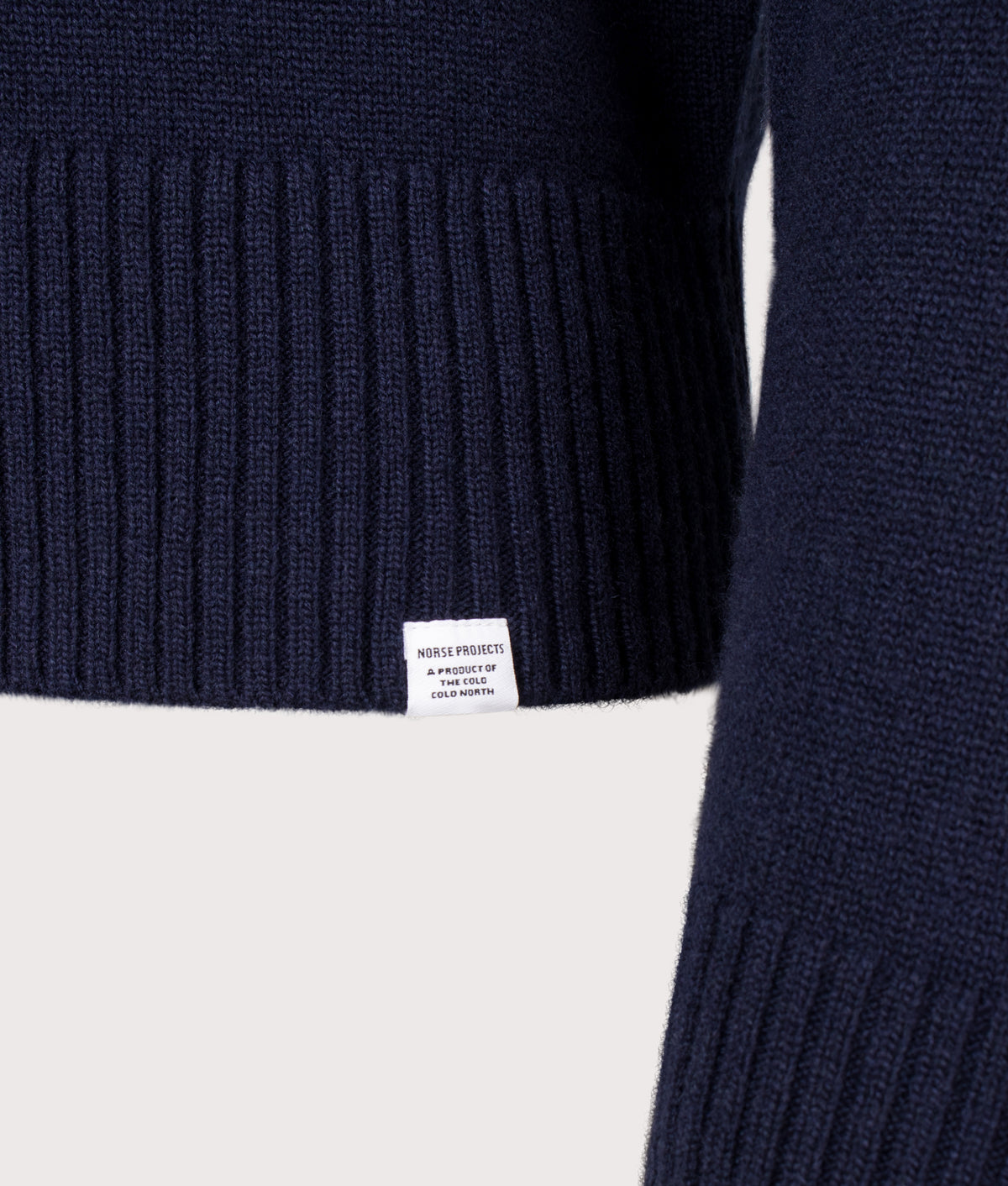 Norse Projects Stensmark Merino Lambswool Knit Jumper in Dark Navy at EQVVS Menswear. Detail shot.