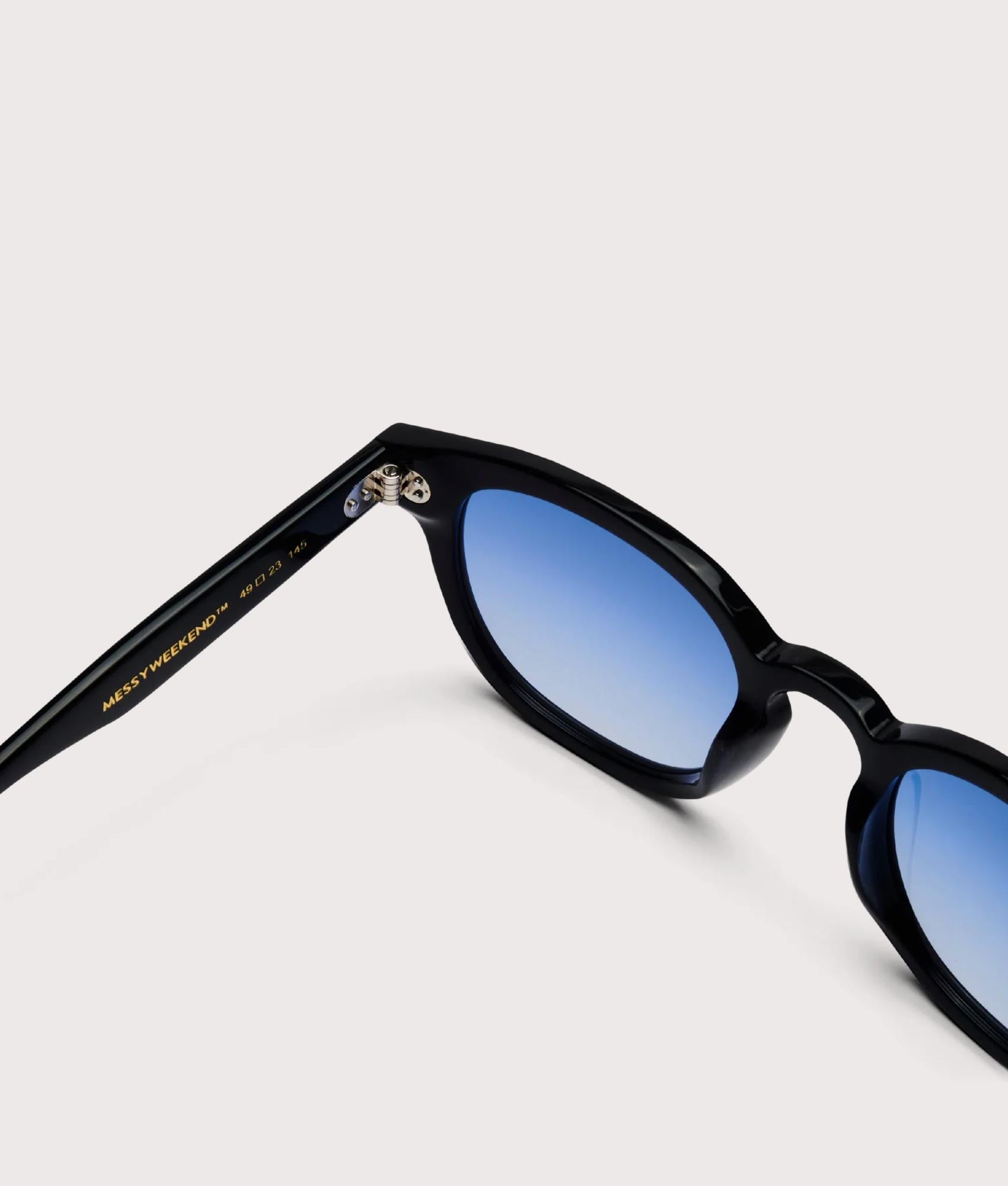 MessyWeekend Billie Bio Sunglasses in black and gradient blue Lens at EQVVS. Detail Shot.