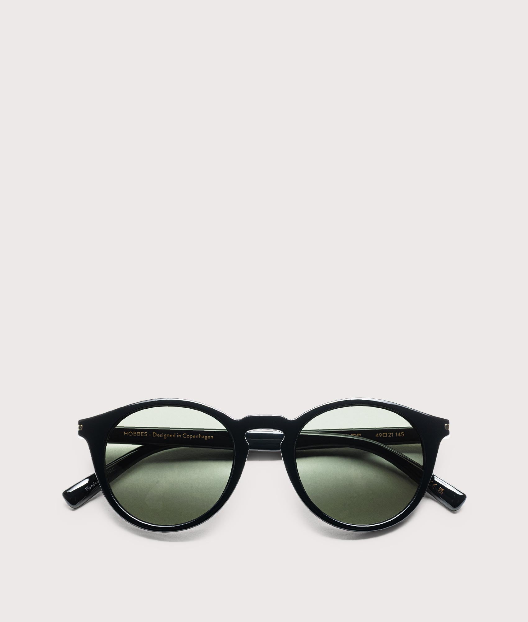 MESSYWEEKEND Hobbes sunglasses in Black - Green Lens at EQVVS Menswear. Folded shot.