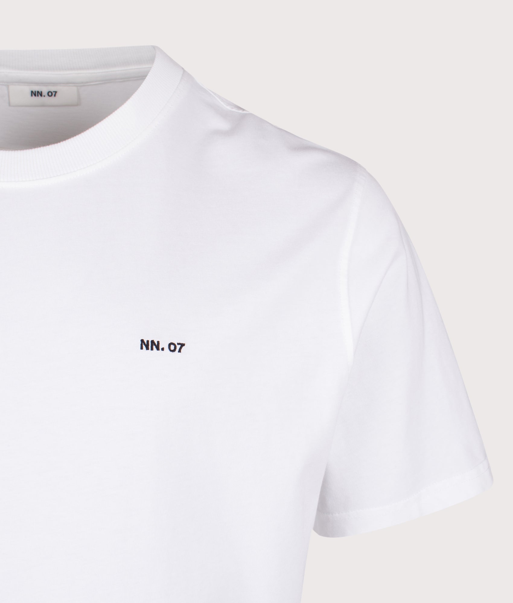 NN.07 Adam EMB T-Shirt in White at EQVVS Menswear.  Detail shot.