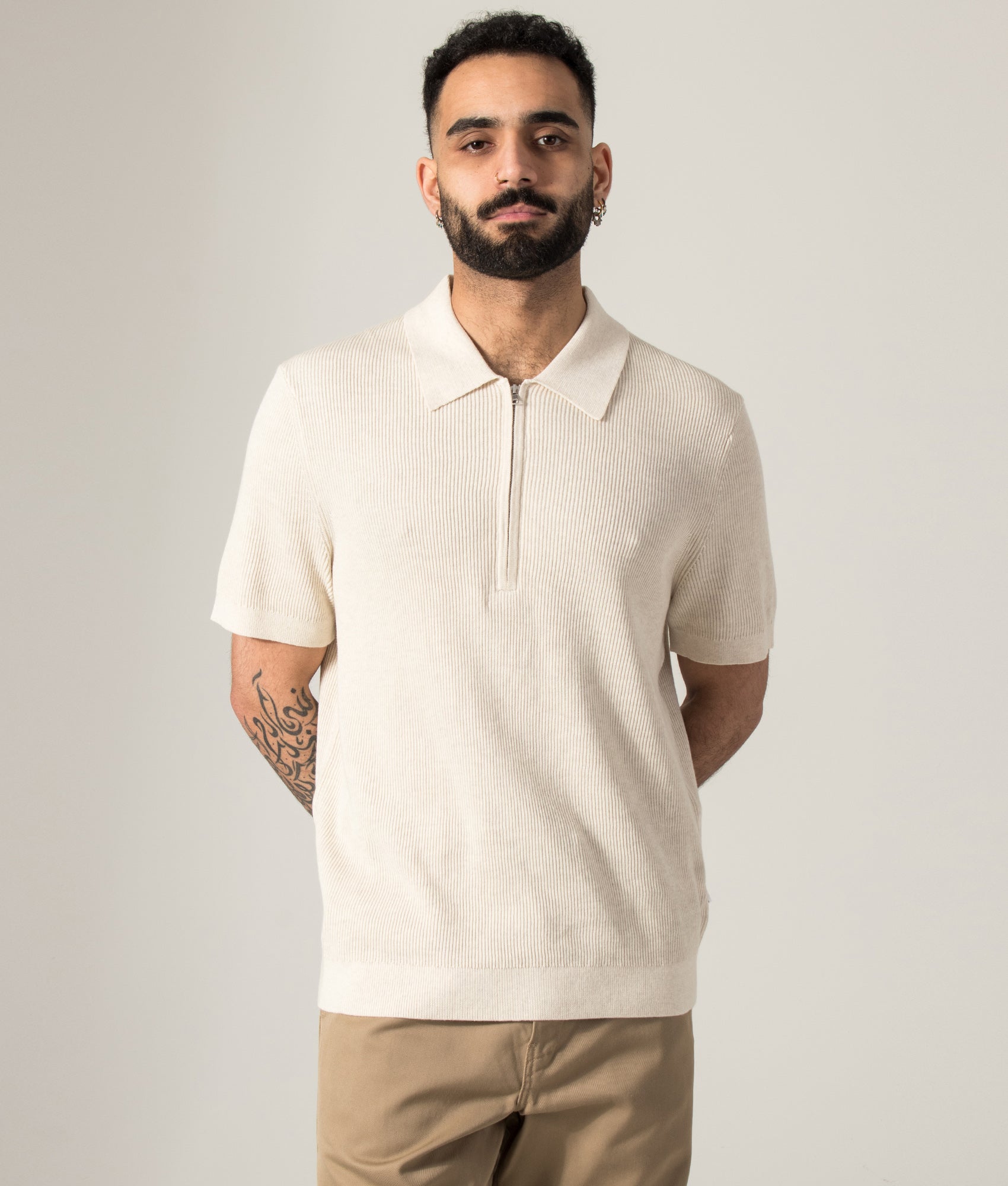 NN.07 Hansie Half Zip Polo Shirt in Ivory at EQVVS Menswear. Model front shot.