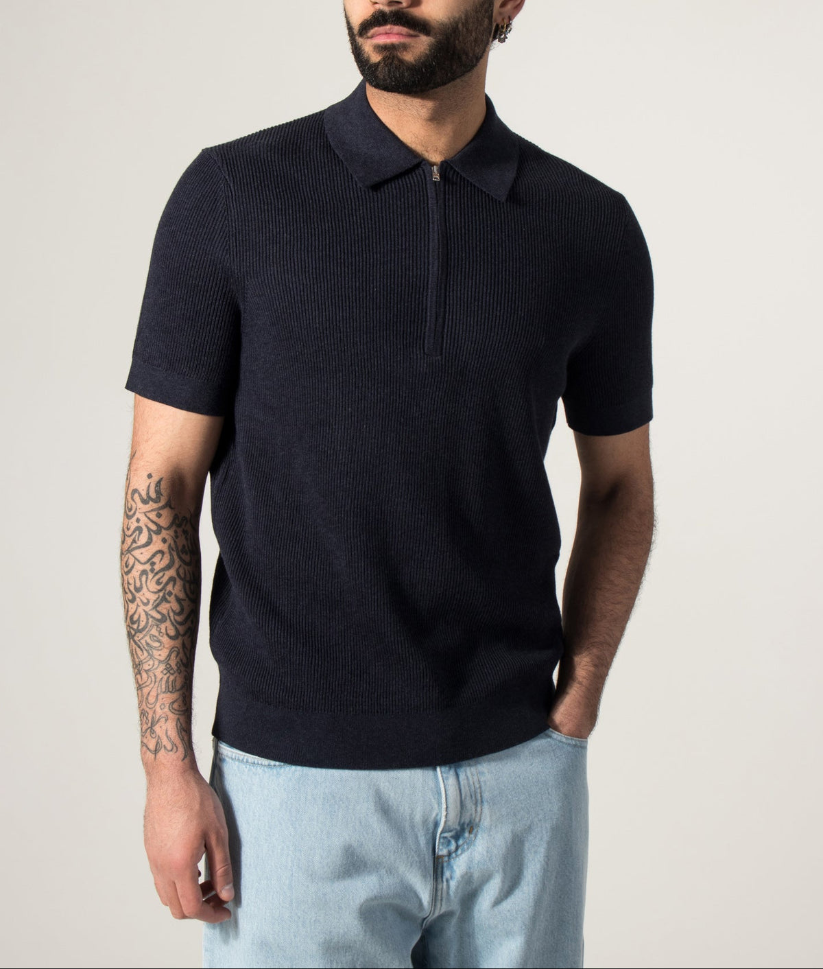 NN.07 Hansie Half Zip Polo Shirt in Navy Melange at EQVVS Menswear. Model front shot.