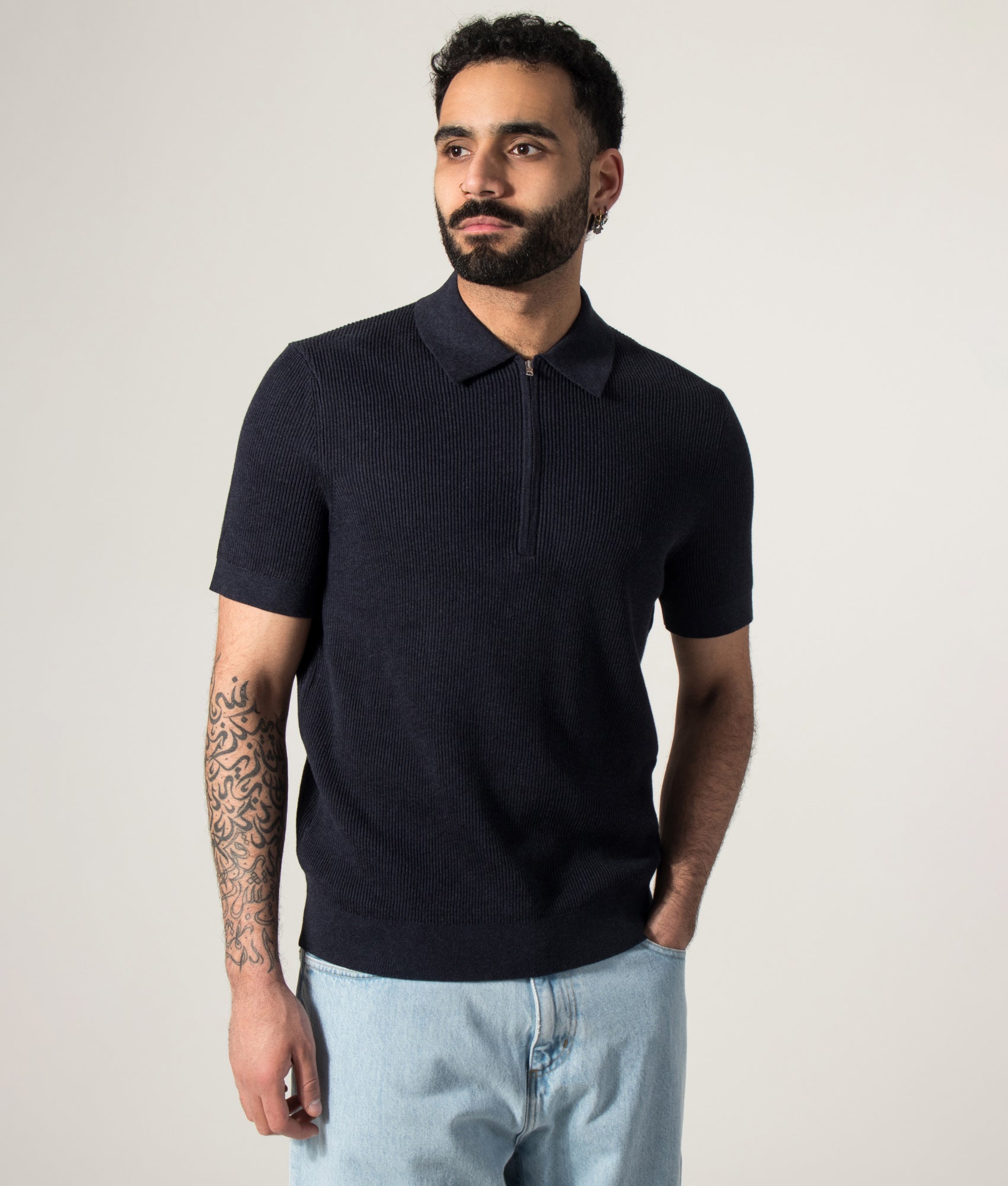 NN.07 Hansie Half Zip Polo Shirt in Navy Melange at EQVVS Menswear. Model front shot.