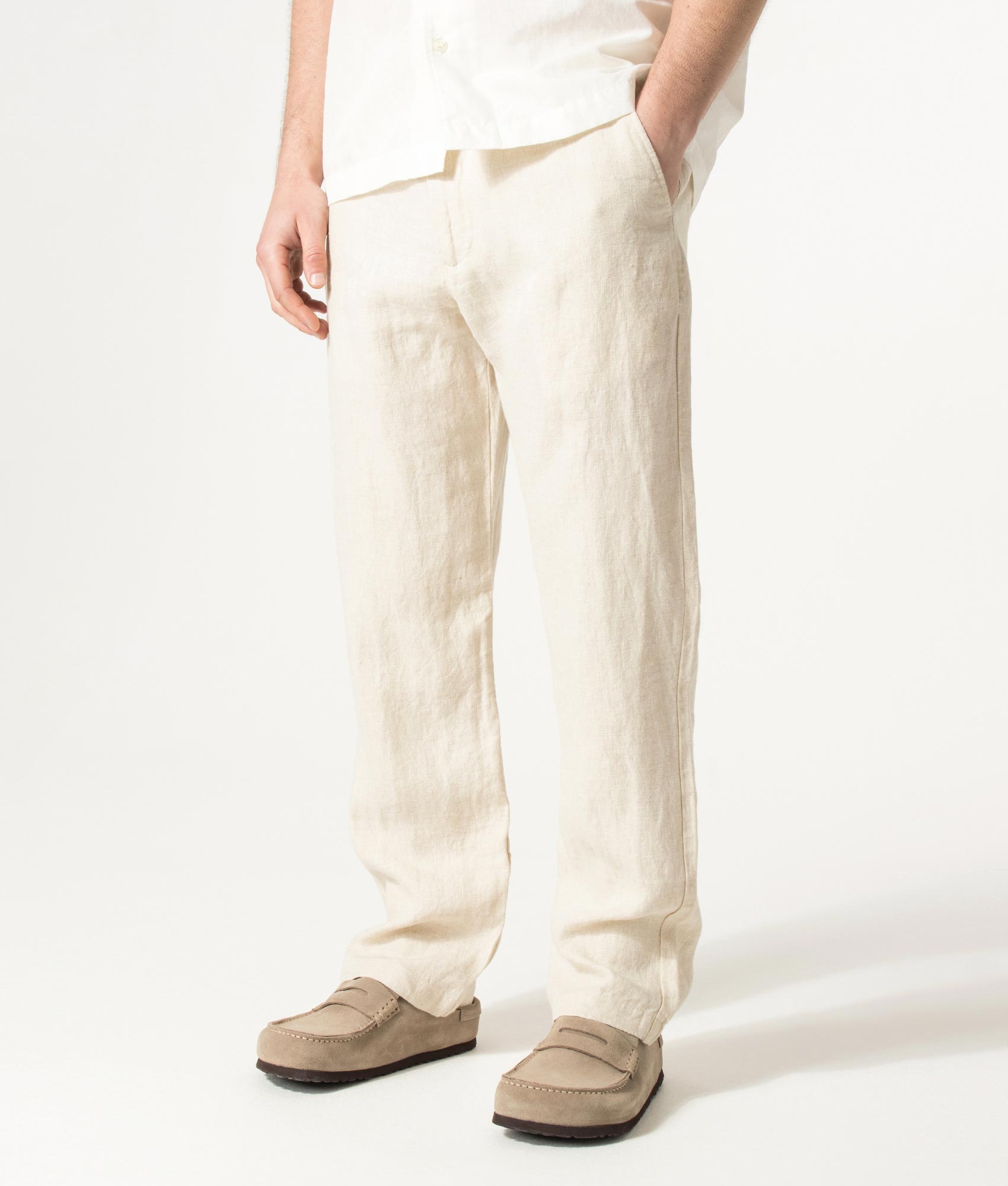 NN.07 Regular Fit Straight Leg Aden Chinos in Oat at EQVVS Menswear. Model angled front shot.