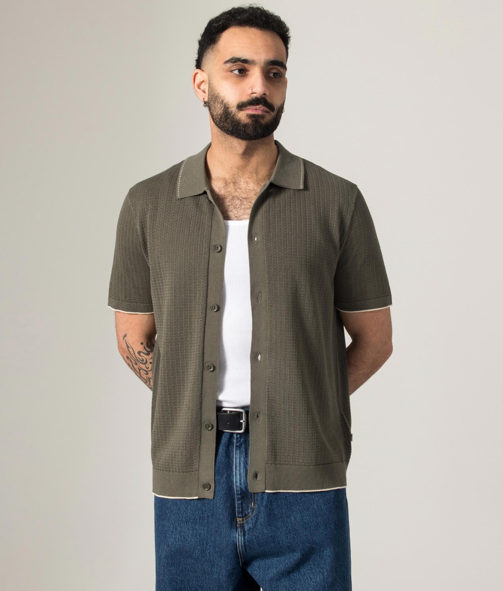 NN.07 Nalo Knit Textured Stitch Polo Shirt in Capers at EQVVS Menswear. Model front shot.