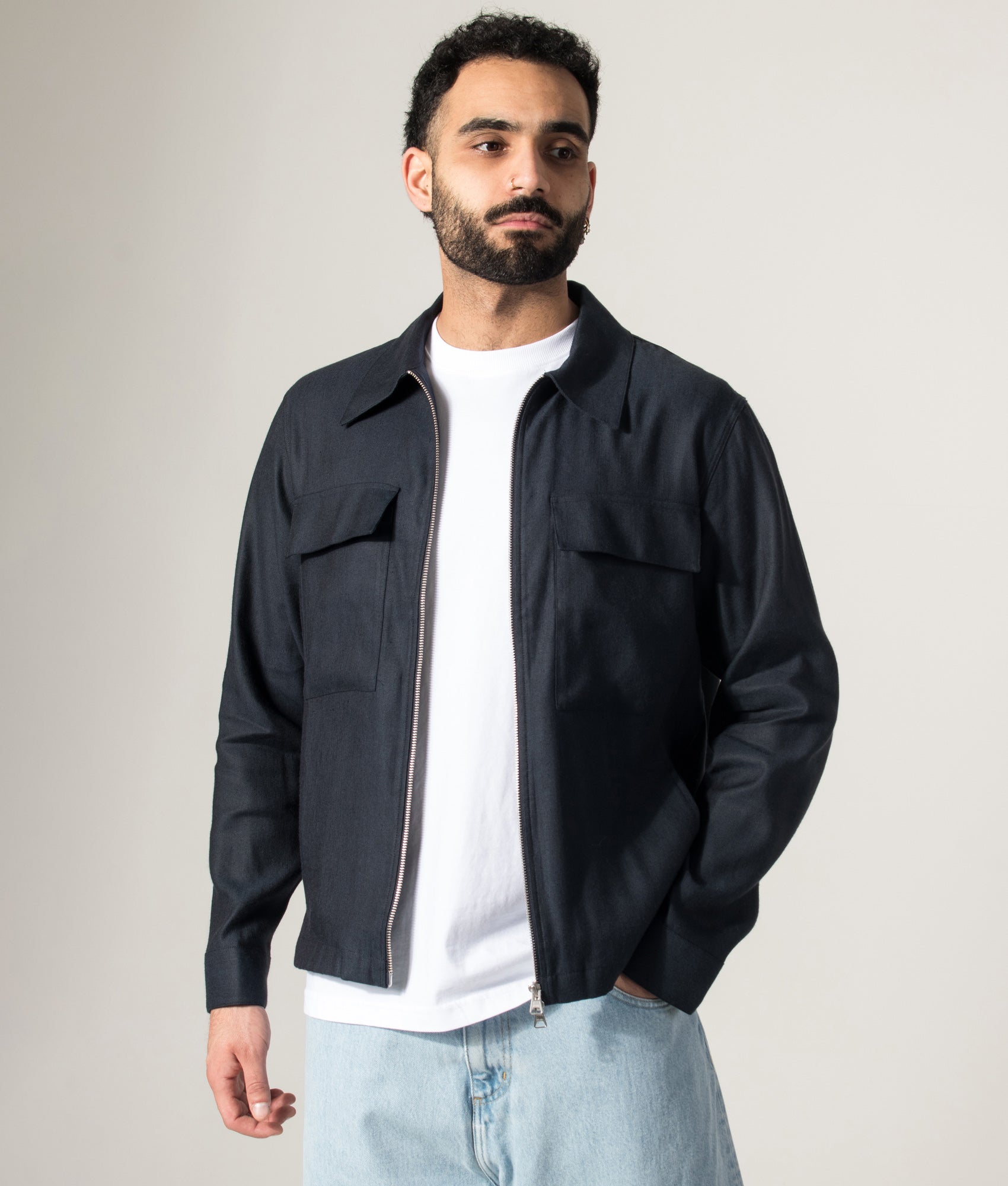 NN.07 Alban Jacket in Deep Navy at EQVVS Menswear. Model front shot.