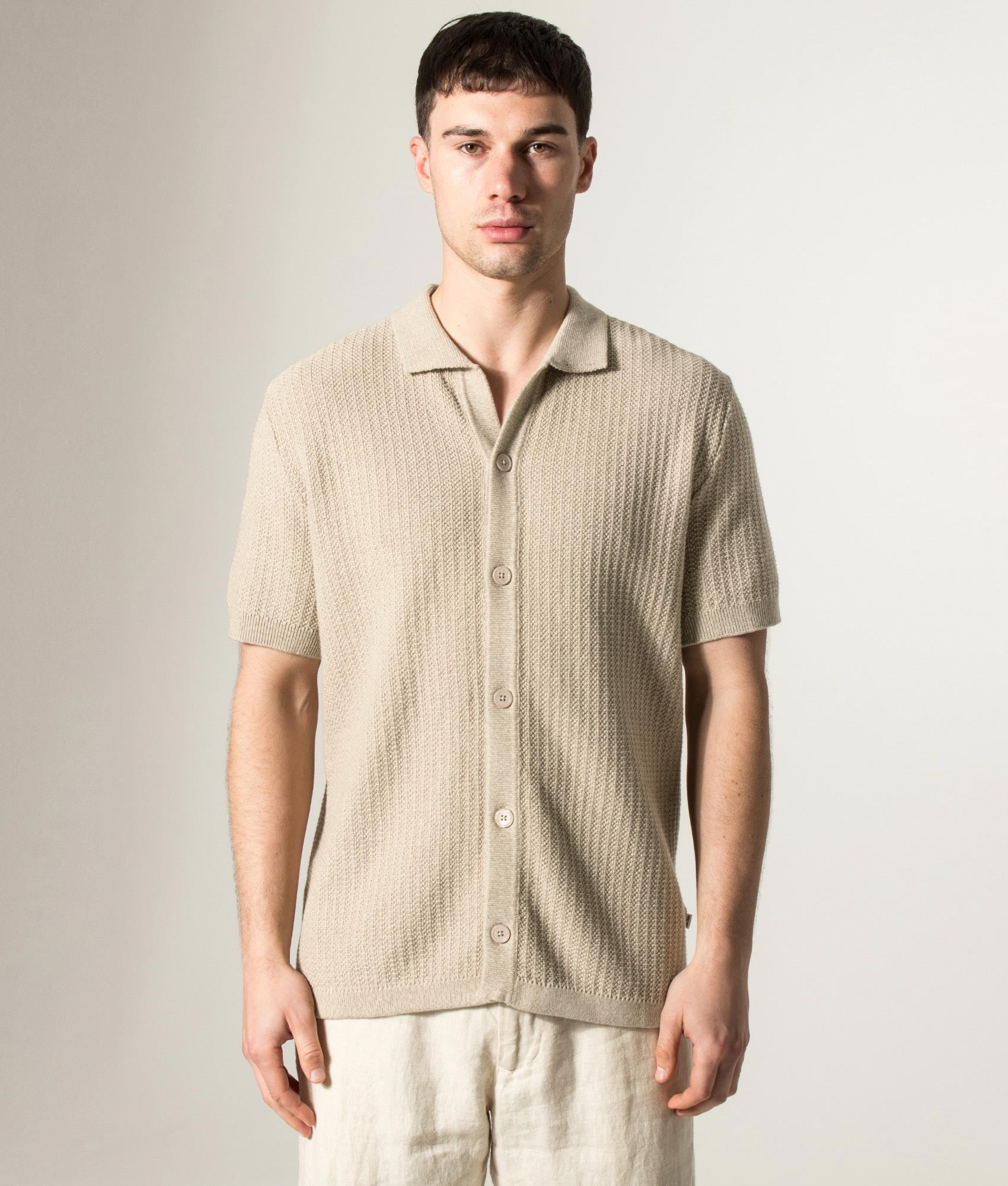 NN.07 Ares knitted Short Sleeve Shirt in Desert Khaki at EQVVS Menswear. Model front shot.