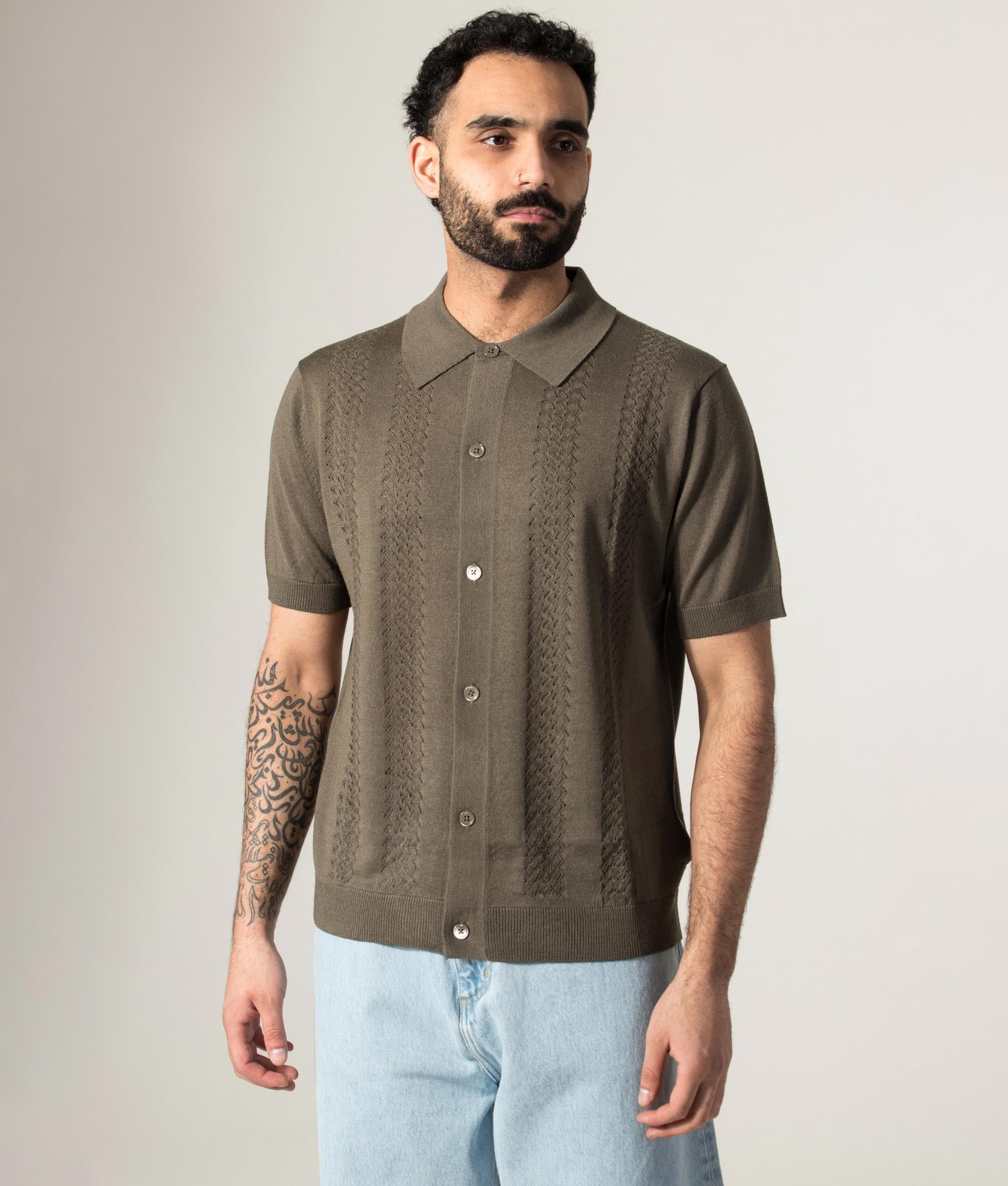 NN.07 Thor Knitted Polo shirt in Mable Husk at EQVVS Menswear. Model front shot.