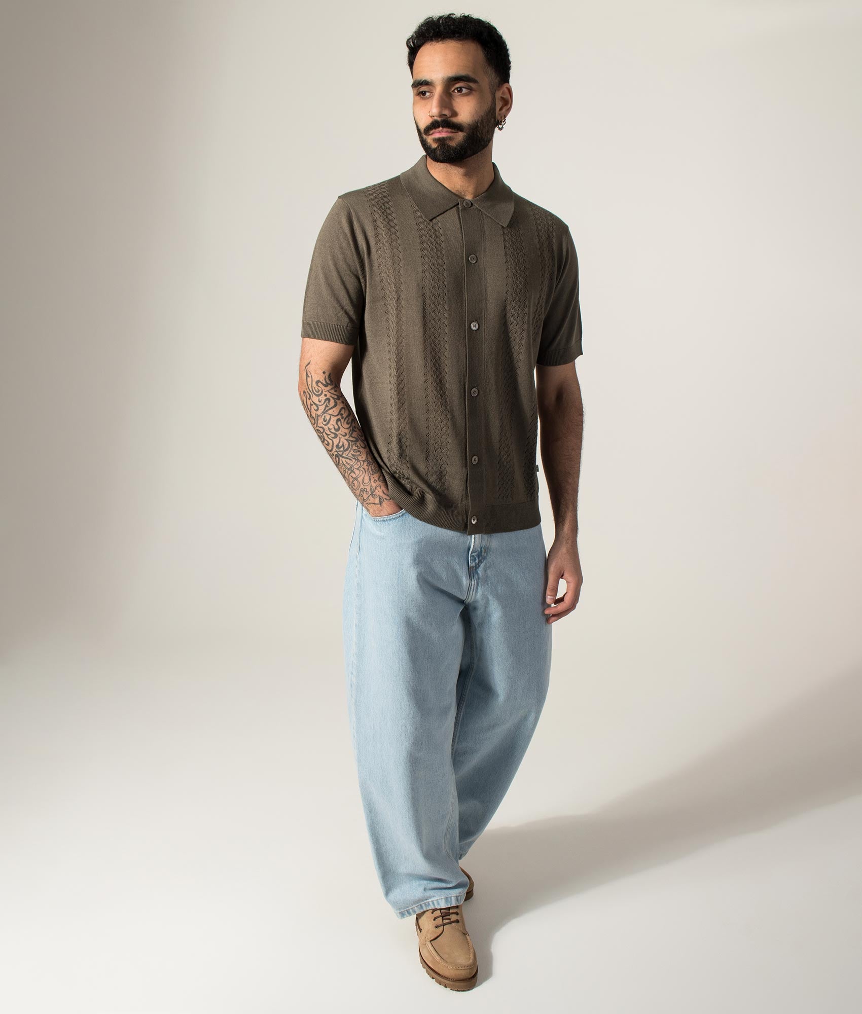 NN.07 Thor Knitted Polo shirt in Mable Husk at EQVVS Menswear. Model front shot.