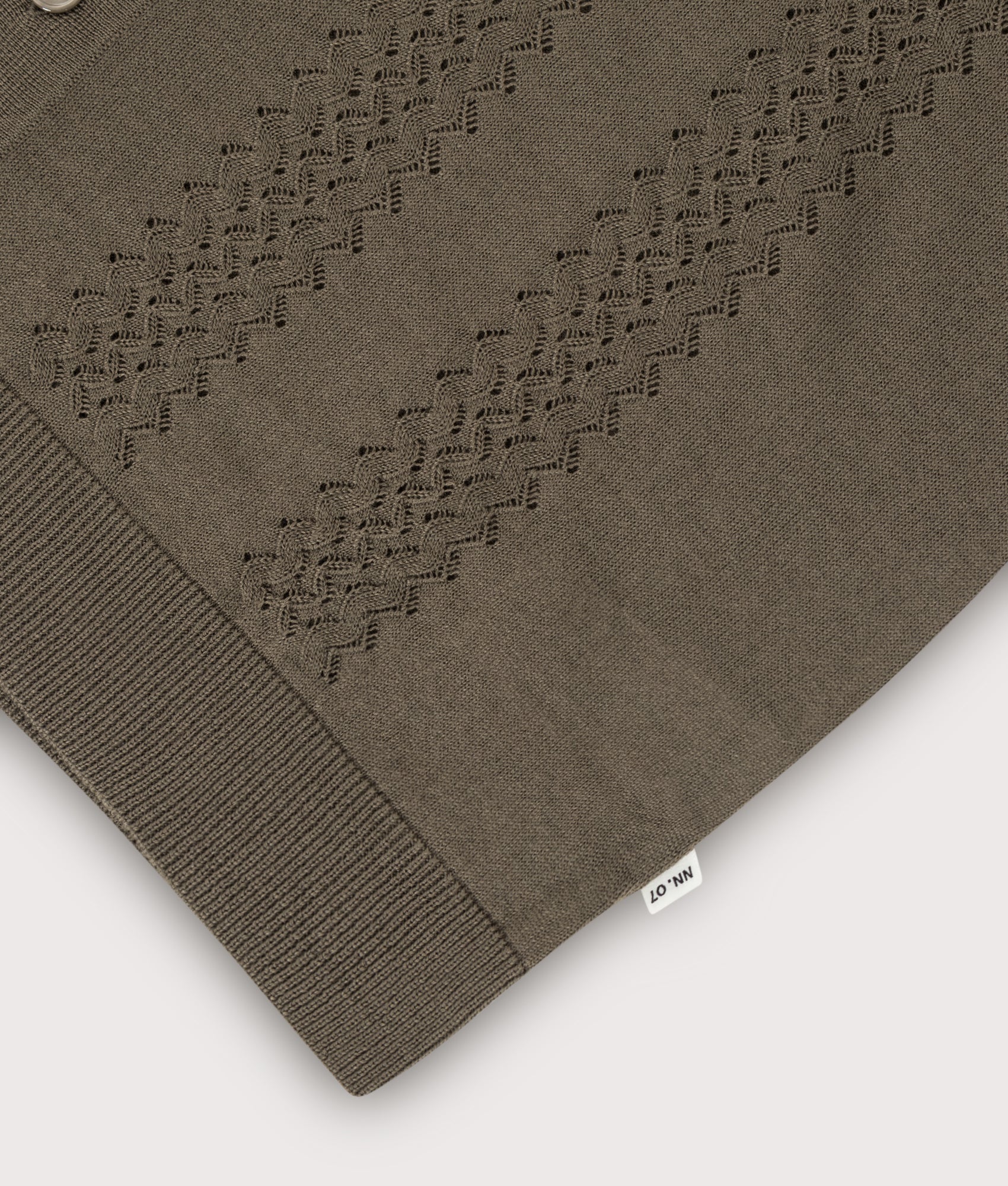 Thor Knitted Polo shirt in Mable Husk by NN.07. Shot by EQVVS. Detail shot.