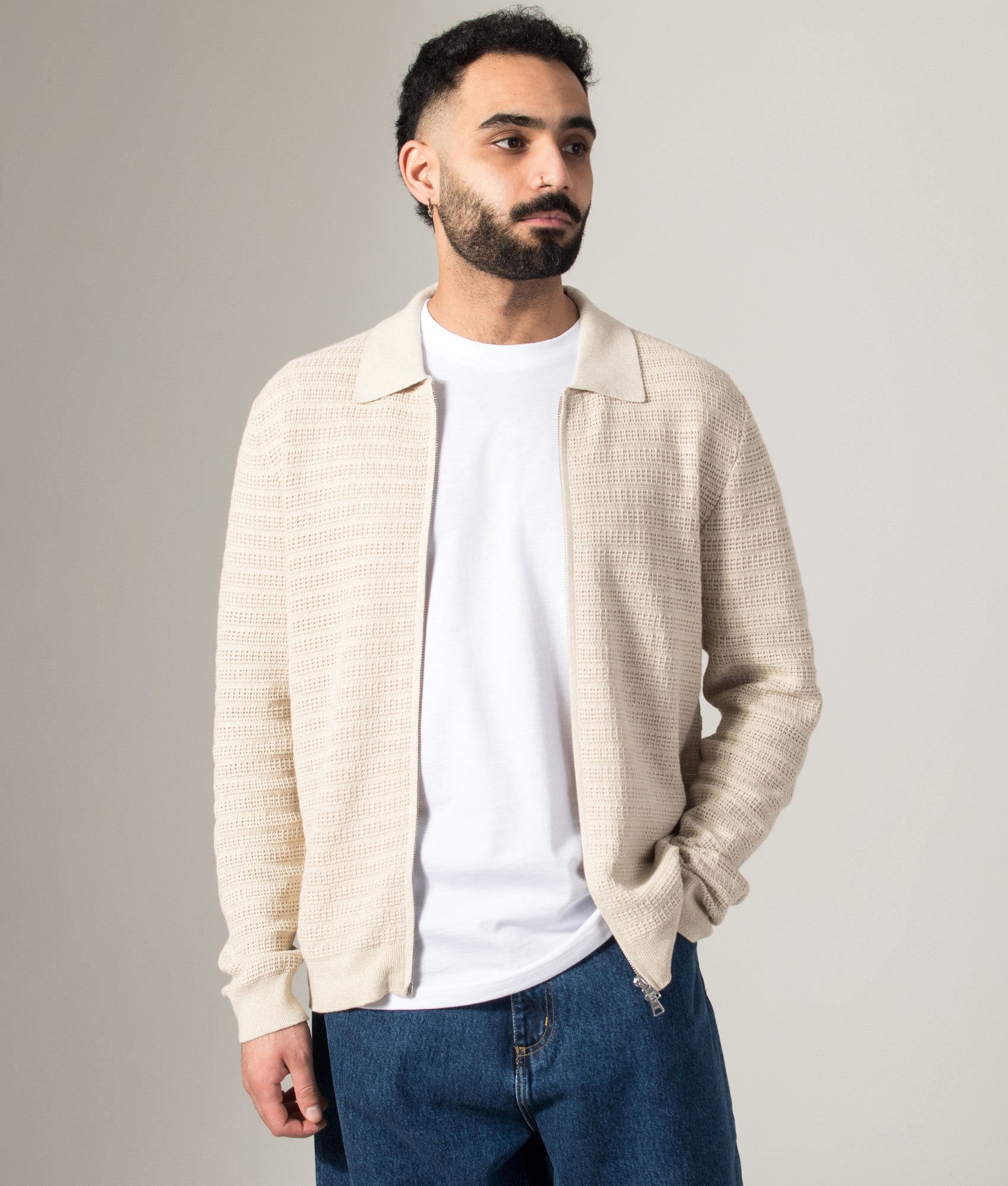 NN.07 Gustav Zip Through Knit Cardigan in Ivory Mouliné at EQVVS Menswear. Model shot.
