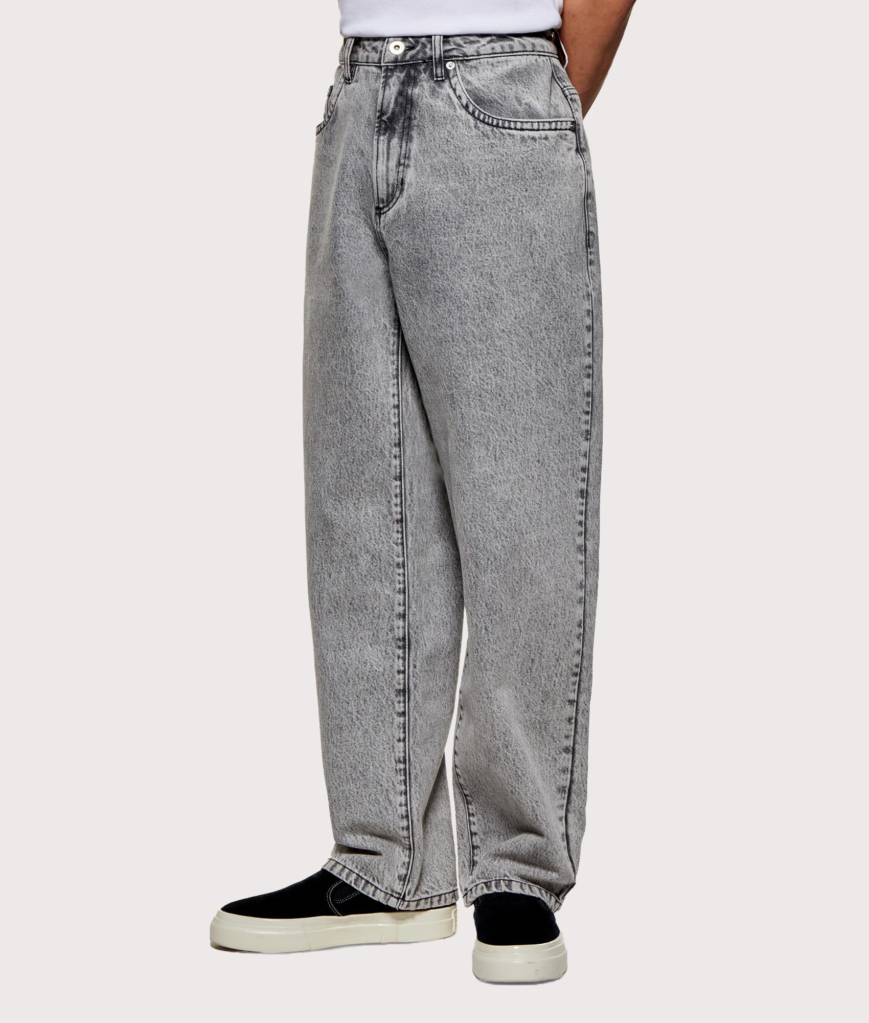 MKI MIYUKI ZOKU Denim Classic Jeans in Washed Black at EQVVS Menswear. Angled model front shot.