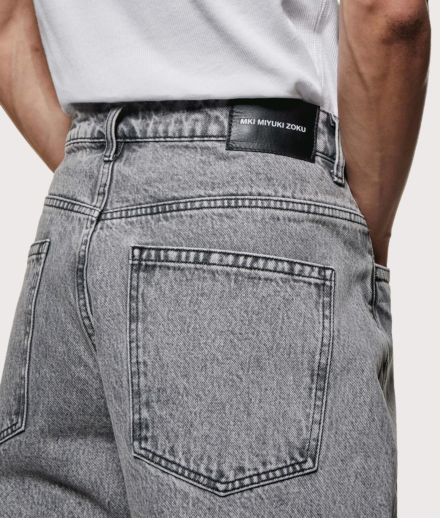 MKI MIYUKI ZOKU Denim Classic Jeans in Washed Black at EQVVS Menswear. Back detail shot.