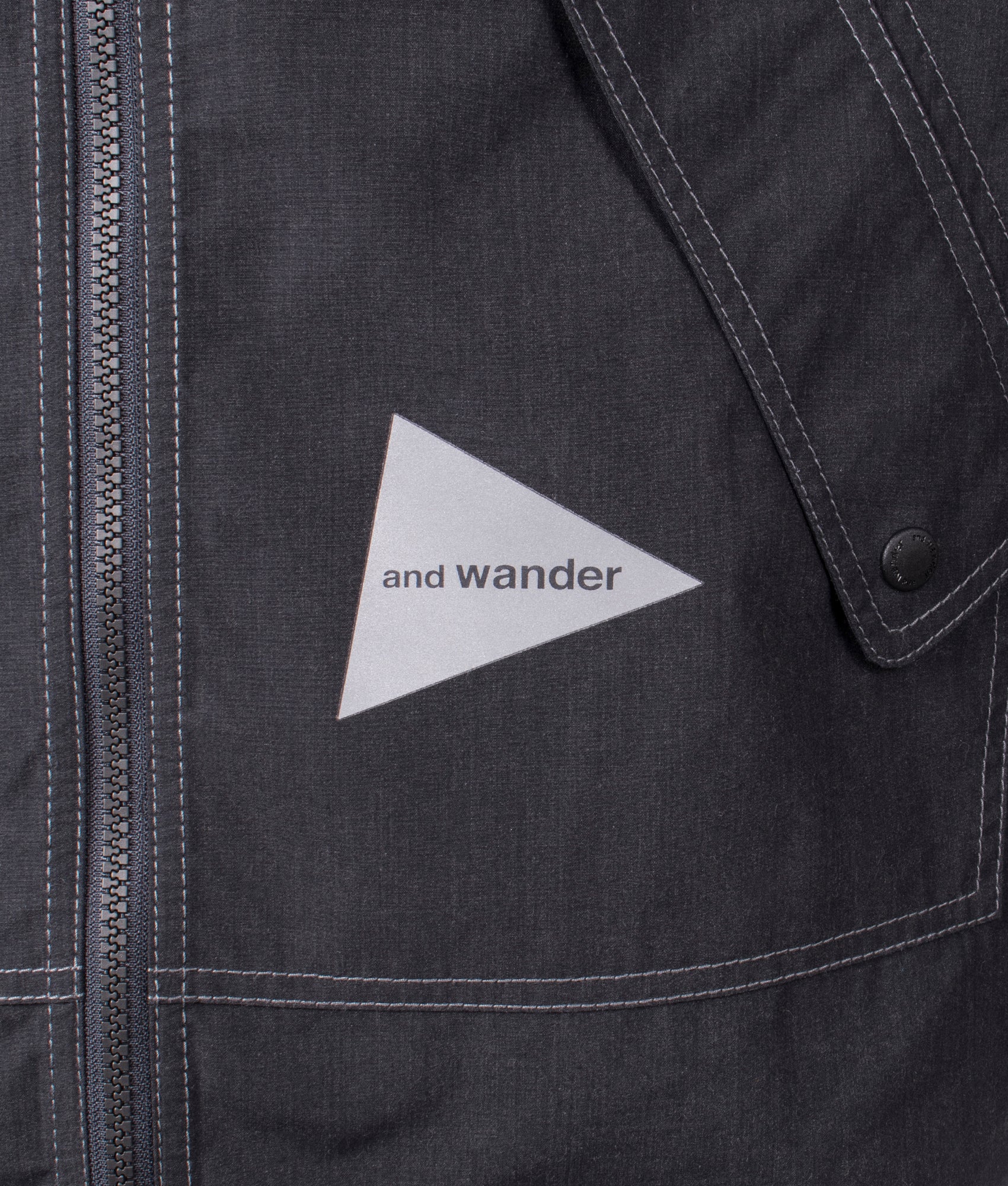 and wander Tough Aramid Hoodie in Charcoal at EQVVS. Detail Shot.