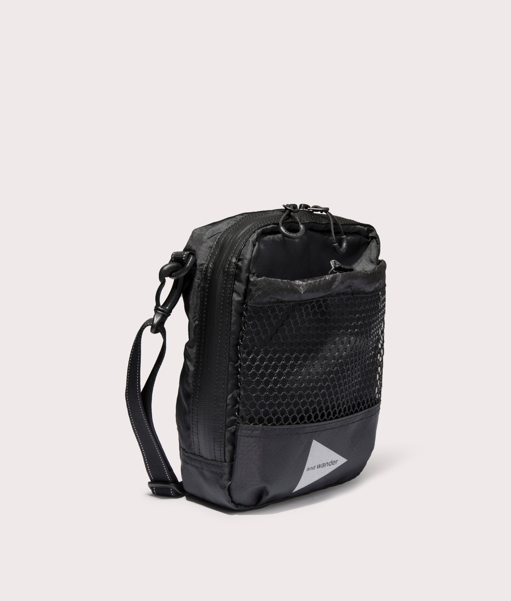 and wander 107  Ecopak Shoulder Pouch in Black at EQVVS. Side Shot.