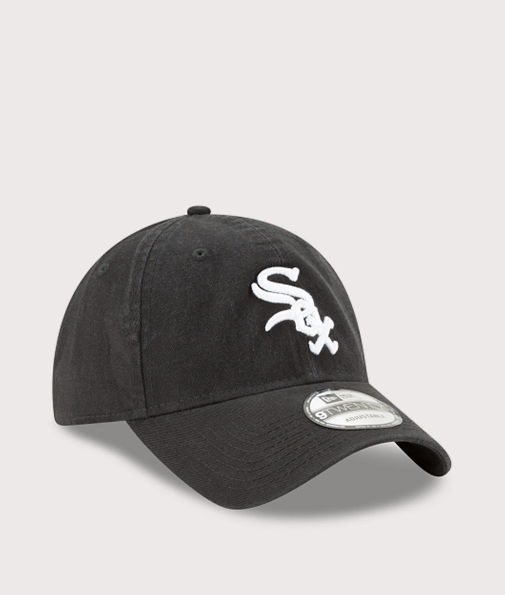 New Era MLB Core Classic Washed 9TWENTY Adjustable Cap in Black at EQVVS Menswear. Angled front shot.