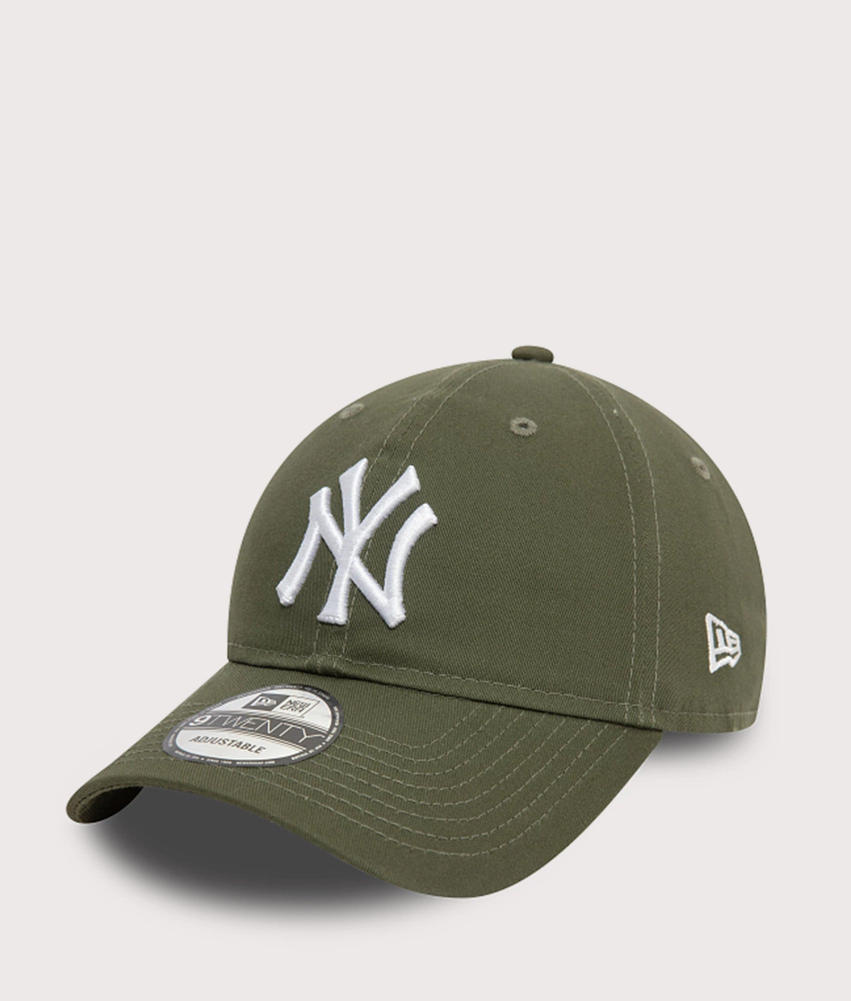 New Era New York Yankees League Essential 9TWENTY Adjustable Cap in Green at EQVVS Menswear. Angled front shot.