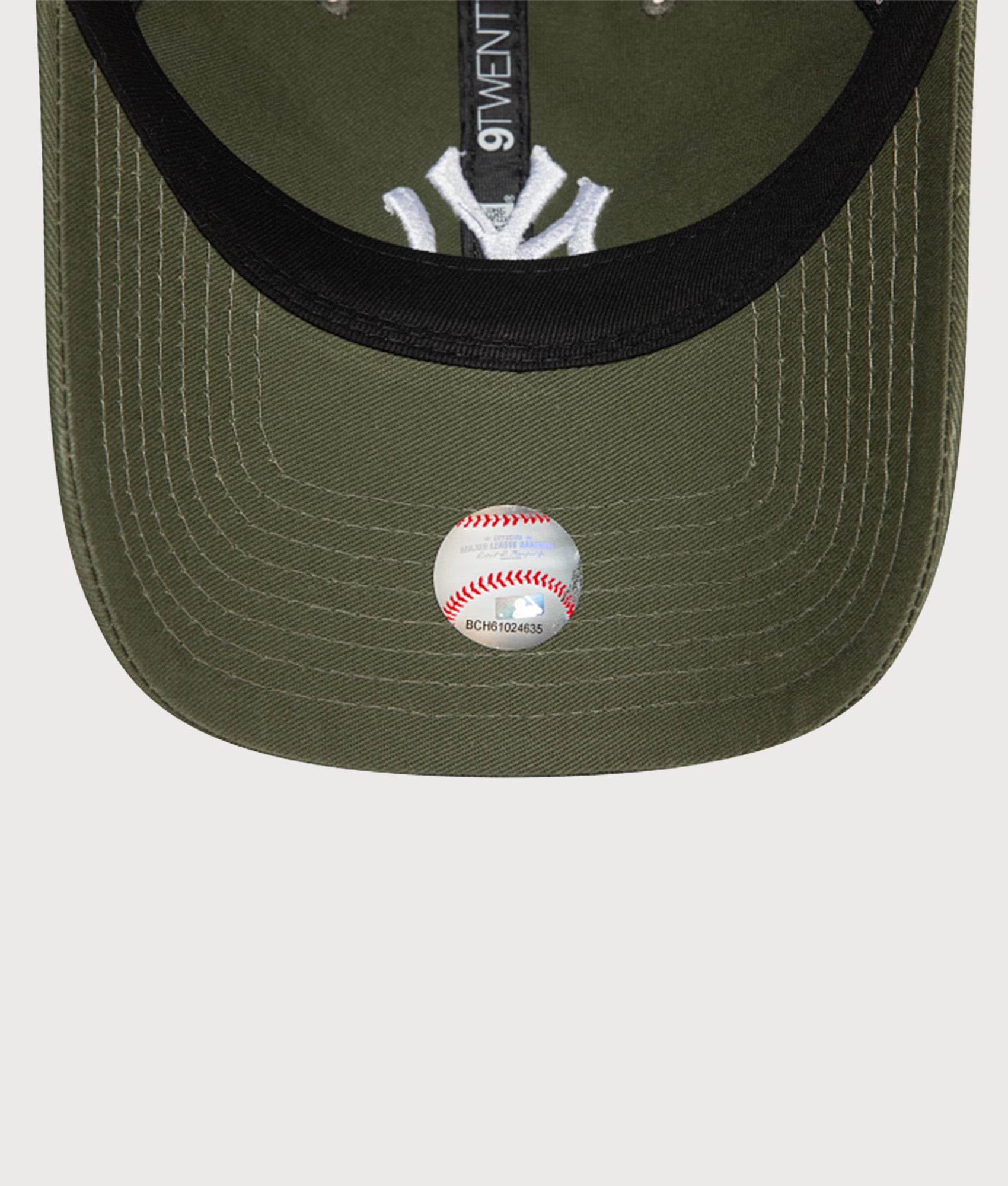 New Era New York Yankees League Essential 9TWENTY Adjustable Cap in Green at EQVVS Menswear. Peak shot.