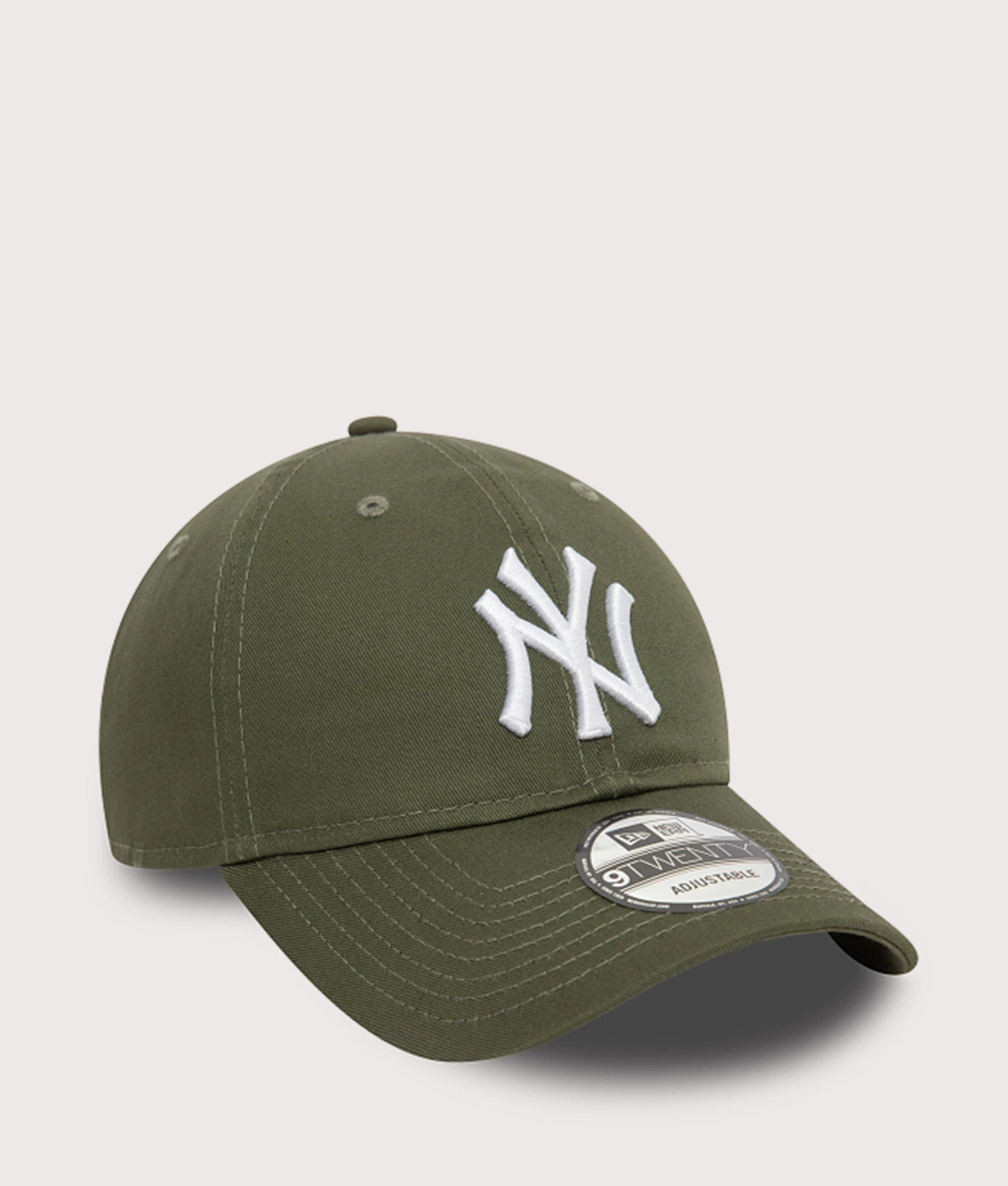 New Era New York Yankees League Essential 9TWENTY Adjustable Cap in Green at EQVVS Menswear. Angled front shot.