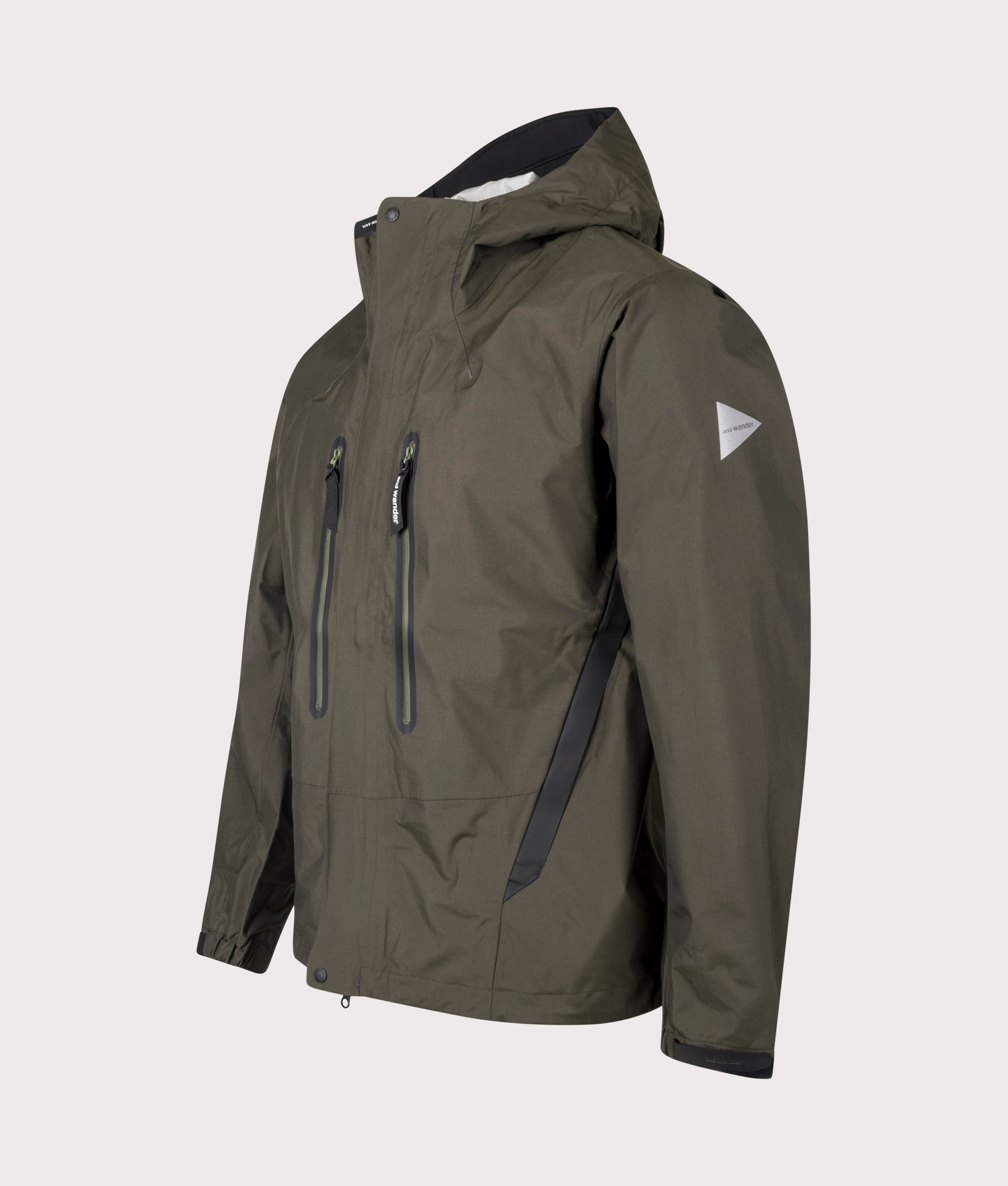 and wander 2.5L Hiker Rain Jacket in Dark Khaki. Shot at EQVVS. Front angle shot 