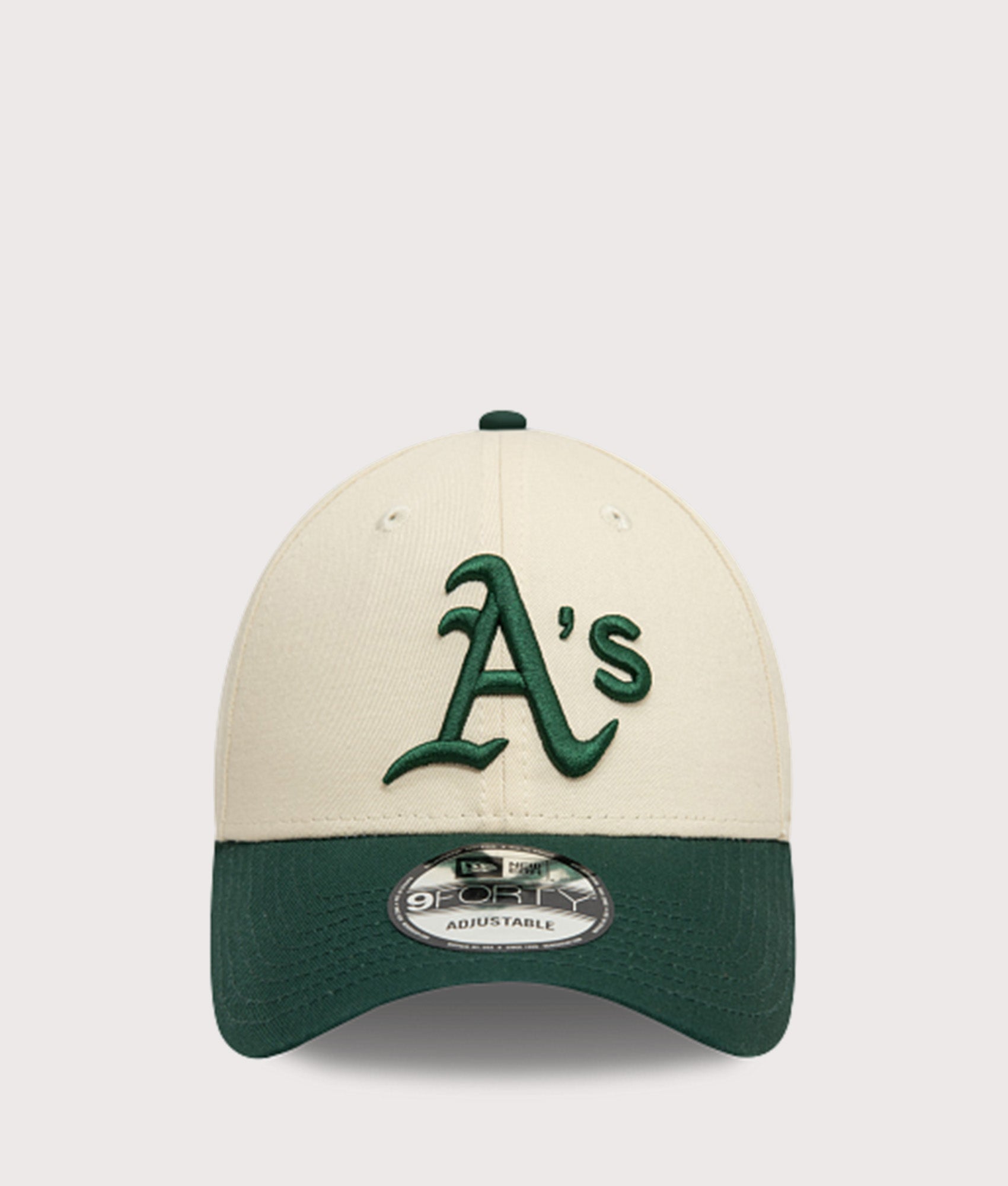 New Era Oakland Athletics Colour Block 9FORTY Adjustable Cap in Cream and Green at EQVVS Menswear. Front shot.