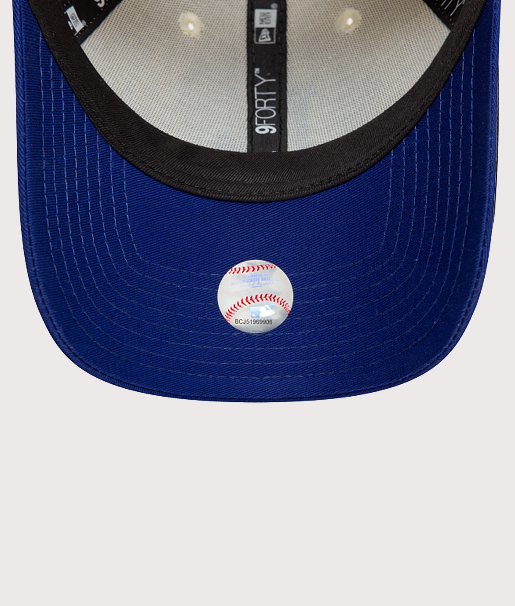 New Era LA Dodgers Colour Block 9FORTY Adjustable Cap in Cream and Blue at EQVVS Menswear. Peak shot.