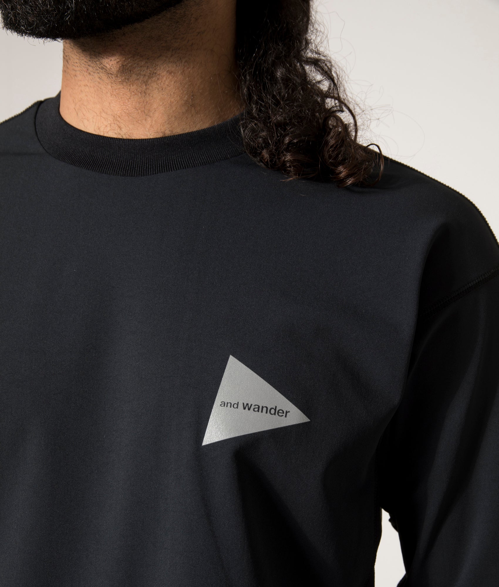 and wander Rash Guard Long Sleeve T-Shirt in Black at EQVVS. Detail Model Shot.