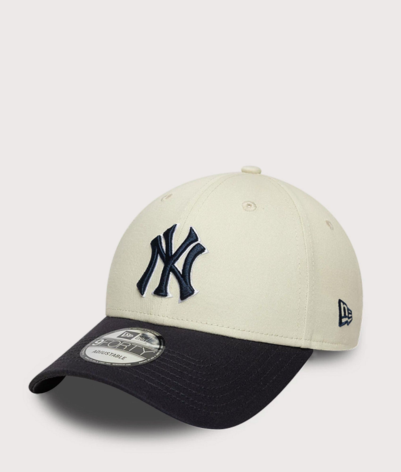New Era New York Yankees MLB World Series Patch 9FORTY Adjustable Cap in  Cream and Navy at EQVVS Menswear. Angled front shot.