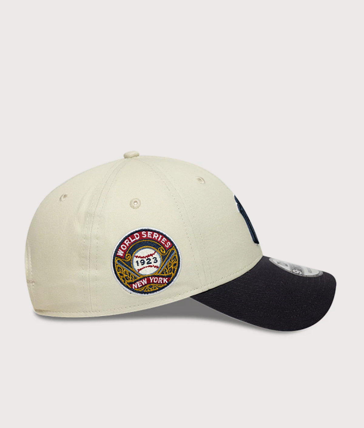 New Era New York Yankees MLB World Series Patch 9FORTY Adjustable Cap in  Cream and Navy at EQVVS Menswear. Side shot.