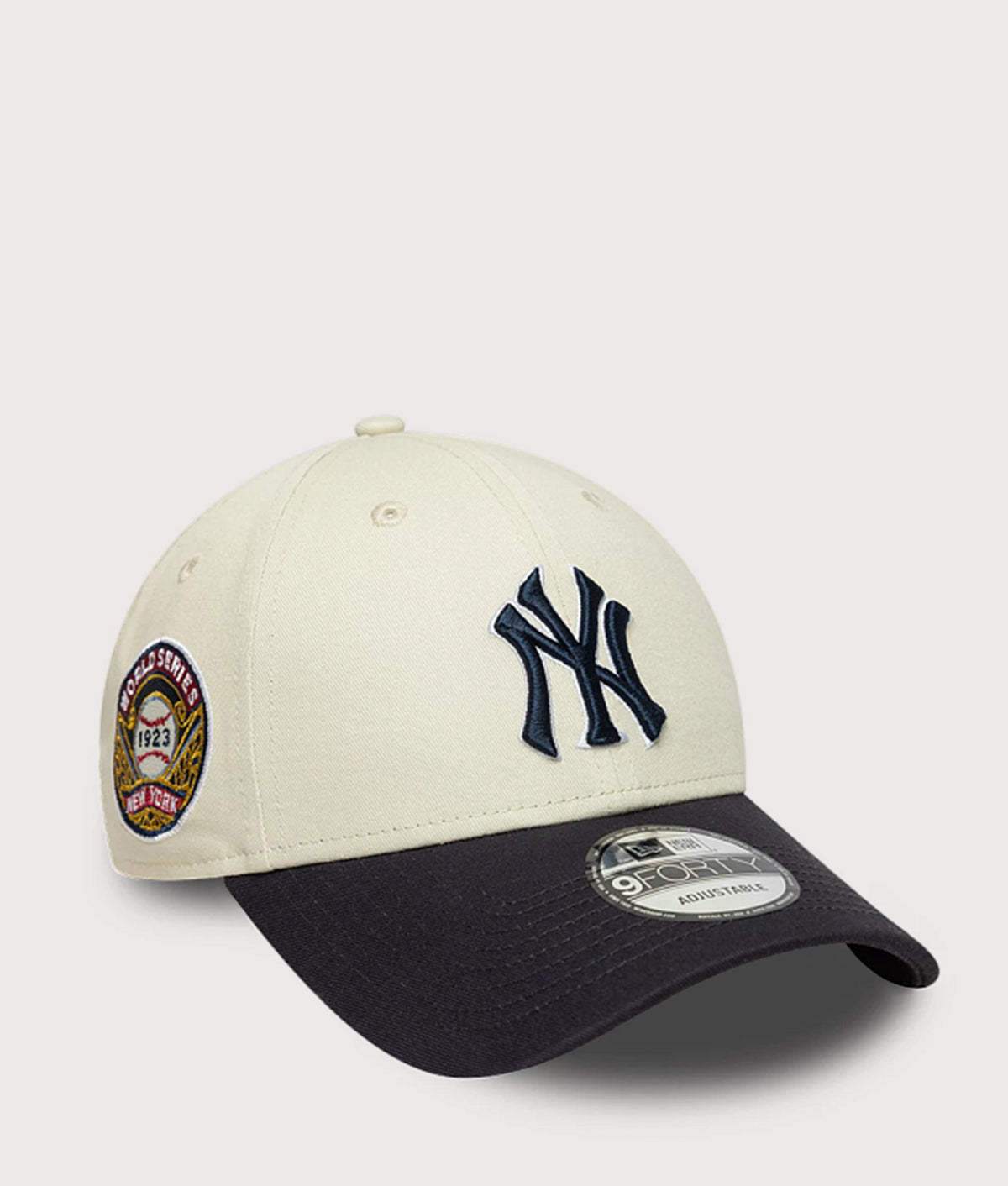 New Era New York Yankees MLB World Series Patch 9FORTY Adjustable Cap in  Cream and Navy at EQVVS Menswear. Angled front shot.