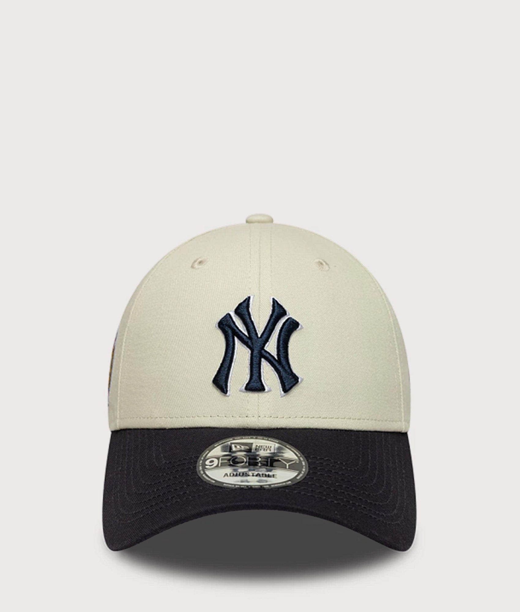 New Era New York Yankees MLB World Series Patch 9FORTY Adjustable Cap in  Cream and Navy at EQVVS Menswear. Front shot.