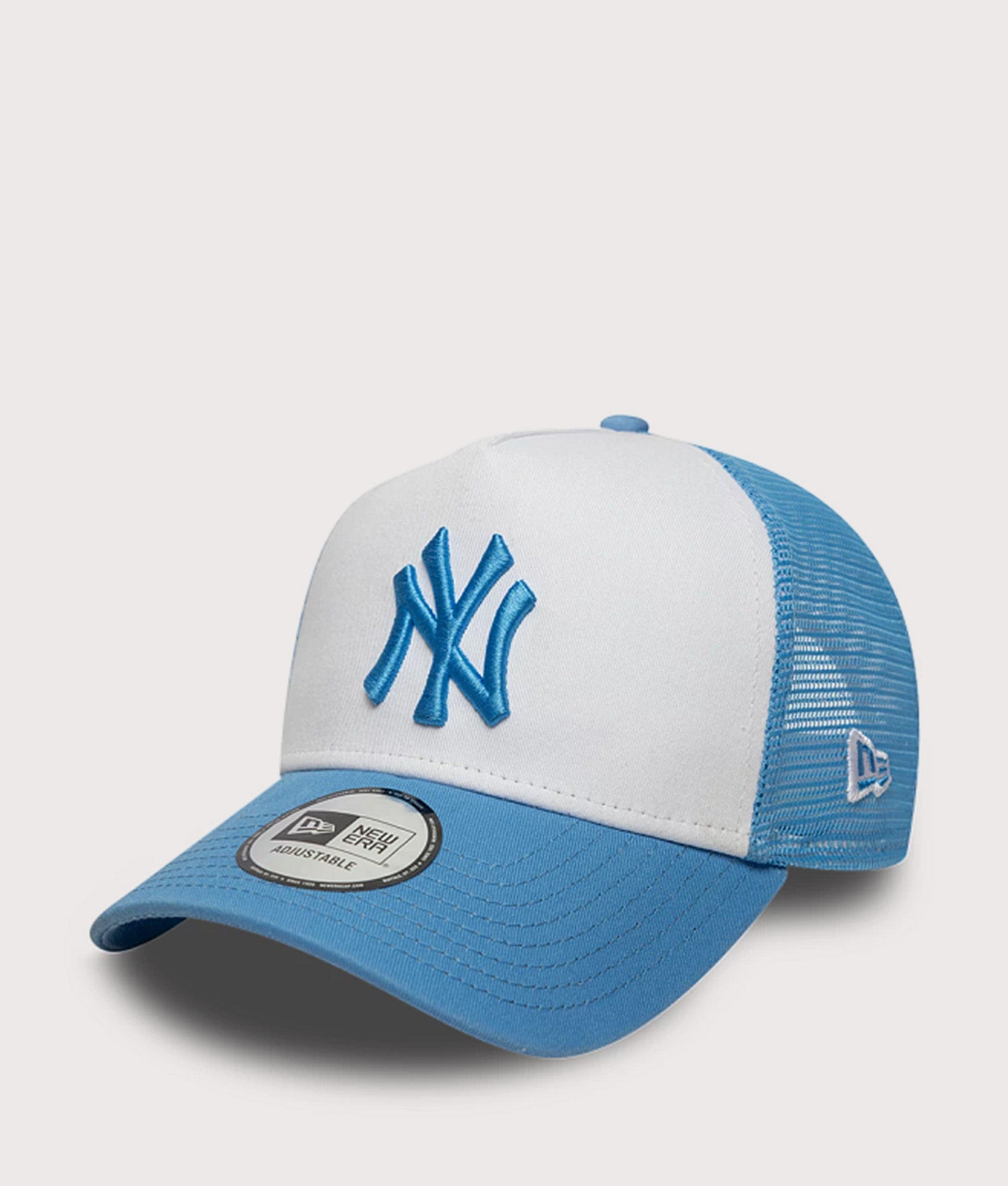 New Era New York Yankees League Essential Trucker Cap in Blue at EQVVS Menswear. Angled front shot.