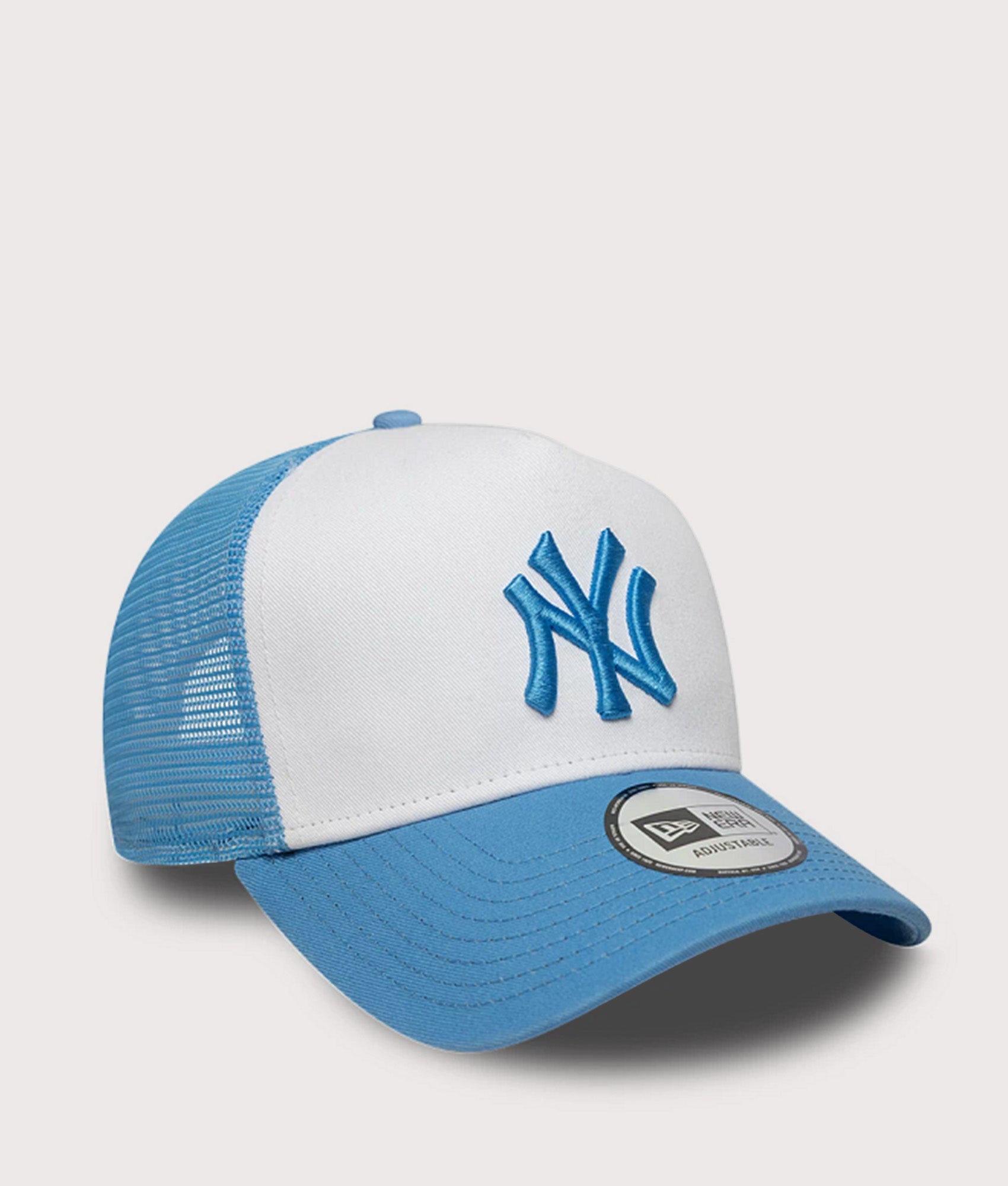 New Era New York Yankees League Essential Trucker Cap in Blue at EQVVS Menswear. Angled front shot.